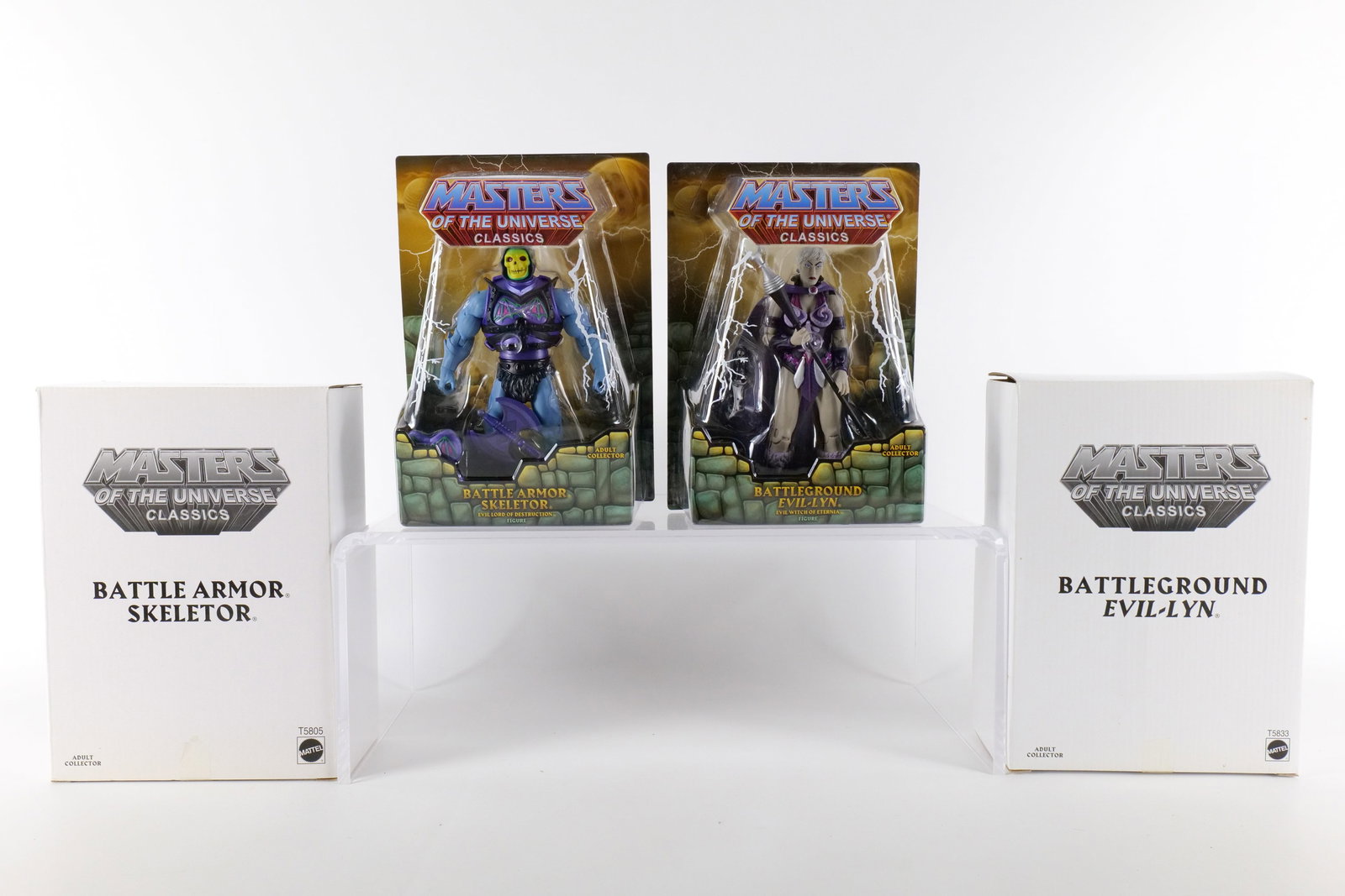 Lot of 2 Masters of the Universe Classics Action Figures: Lot of 2 Masters of the Universe Classics Action Figures. MOTU. Including Battle Armor Skeletor and Battleground Evil-Lyn. Both New in Package - Both come with the white outer boxes. Made by Mattel - 