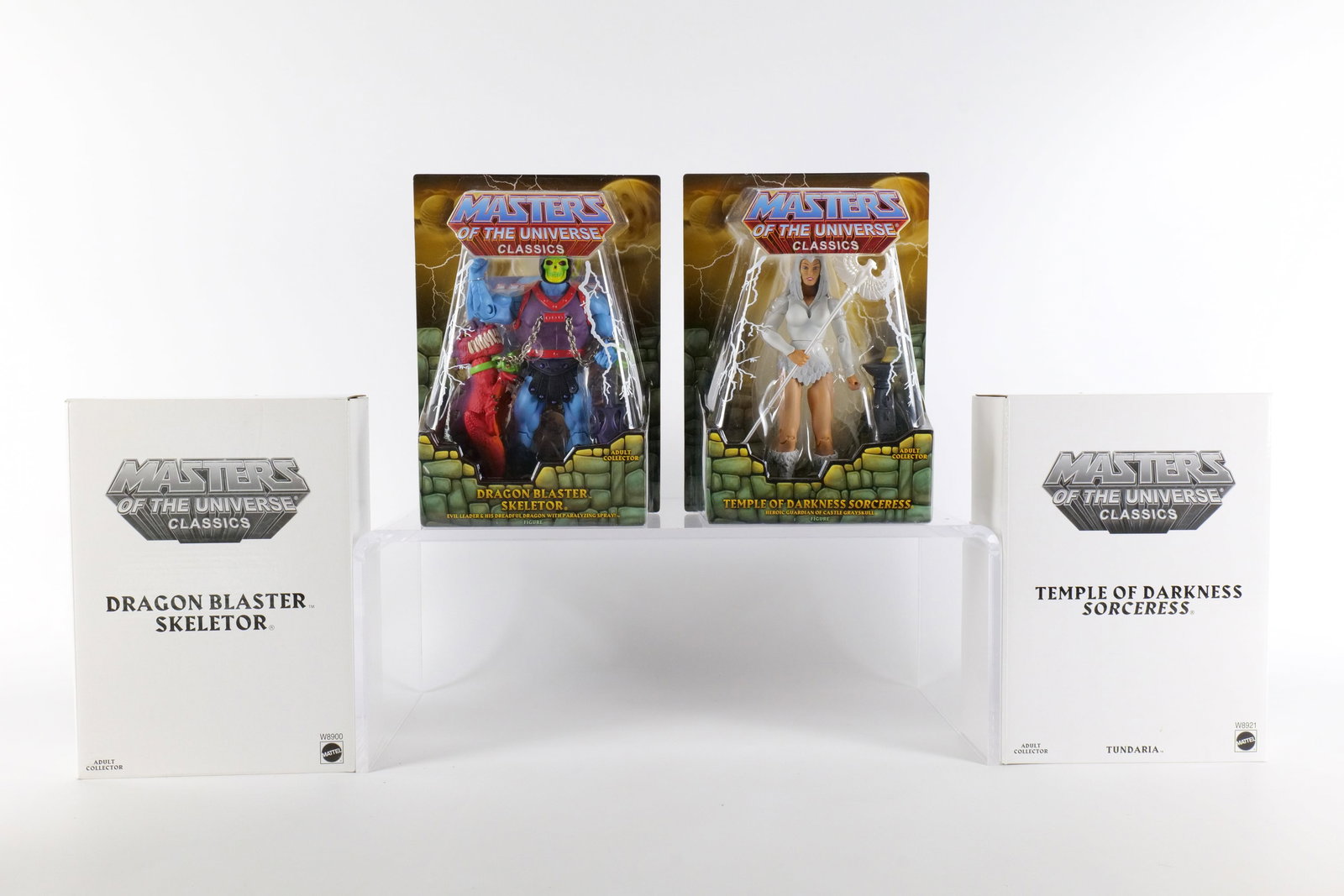 Lot of 2 Masters of the Universe Classics Action Figures: Lot of 2 Masters of the Universe Classics Action Figures. MOTU. Including Dragon Blaster Skeletor and Temple of Darkness Sorceress. Both New in Package - Both come with the white outer boxes. Made by 