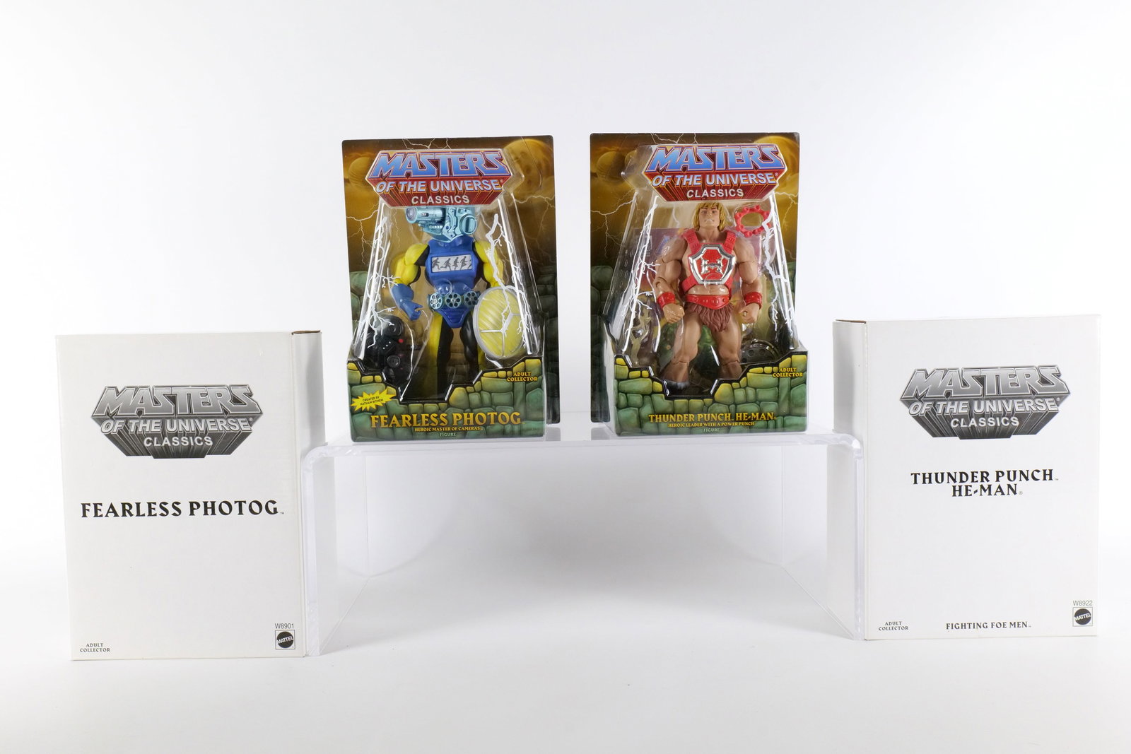 Lot of 2 Masters of the Universe Classics Action Figures: Lot of 2 Masters of the Universe Classics Action Figures. MOTU. Including Fearless Photog and Thunder Punch He-Man. Both New in Package - Both come with the white outer boxes. Made by Mattel - 2011/20