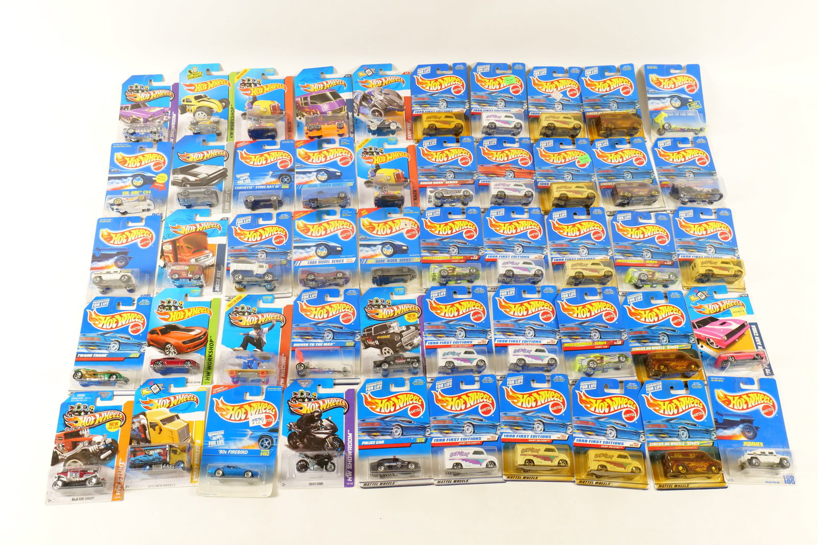 Lot of 50 Carded Hot Wheels: Lot of 50 Carded Hot Wheels. Including Classic Nomad, Sol-Aire CX4, Hummer, Twang Thang, Baja Bone Shaker, Custom Volkswagen Beetle, Bread Box, Hiway Hauler 2, and More. Includes some duplicates. Some