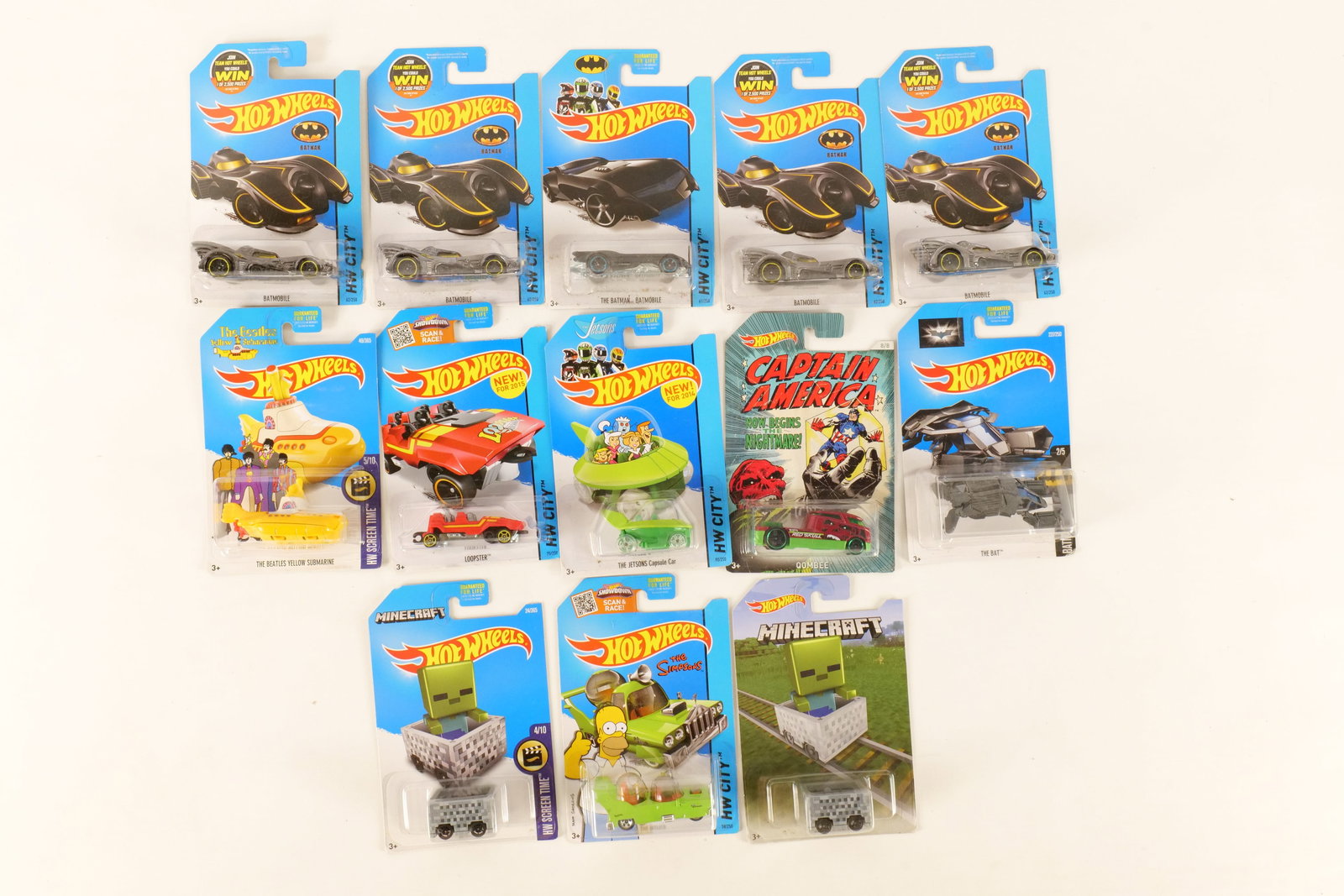 Lot of 13 Hot Wheels Cars: Lot of 13 Hot Wheels Cars. Including Minecart, The Beatles Yellow Submarine, Loopstar, Captain America Red Skull, The Bat and More. Some duplicates. Packaging has some wear. All invoices must be paid 