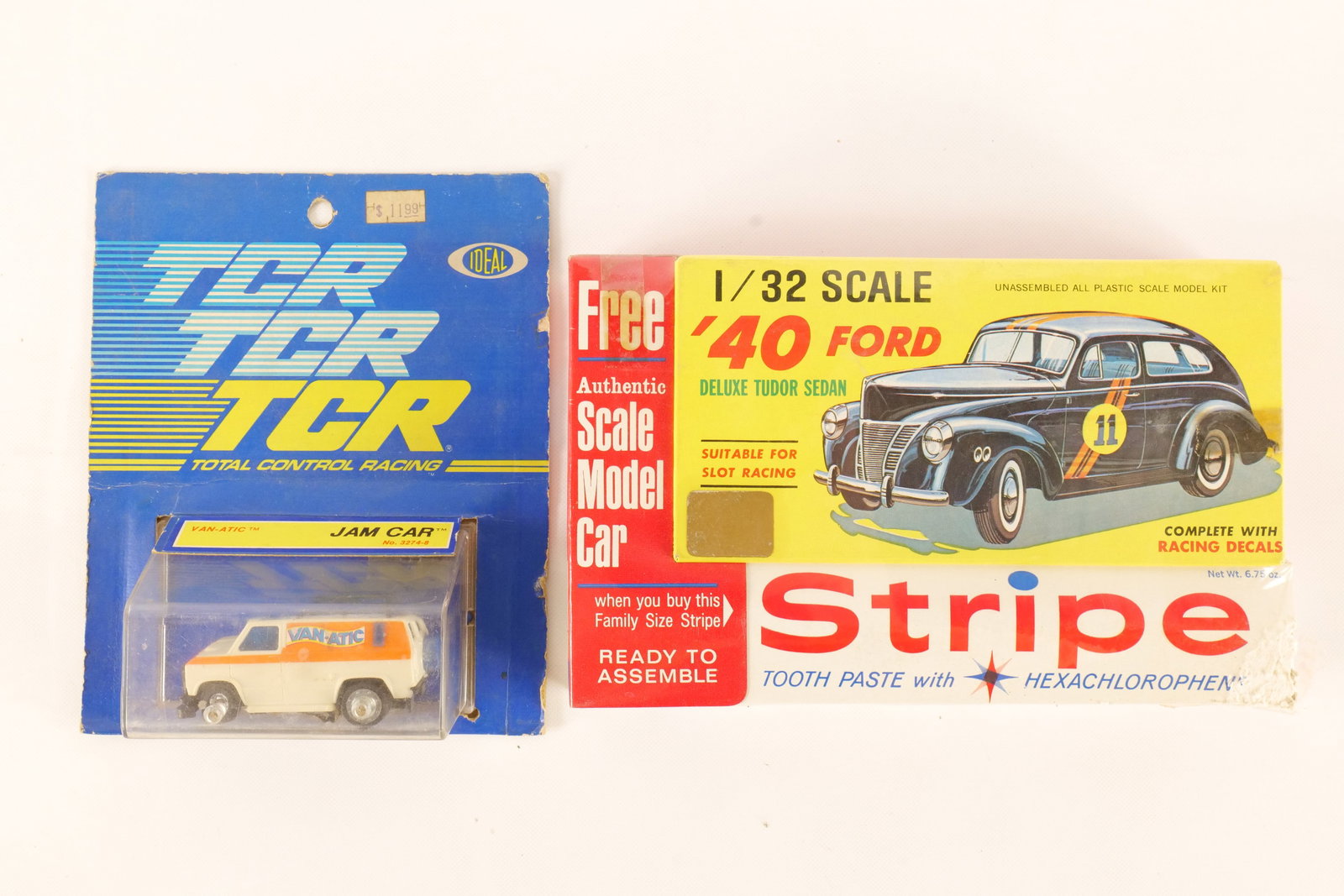 Lot of 2 Car Collectibles: Lot of 2 Car Collectibles. Including TCR Jam Car Slot Car and Stripe Toothpaste Pack with '40 Ford Deluxe - Some damage to the box. Some wear to packaging. All invoices must be paid within 24 hours of