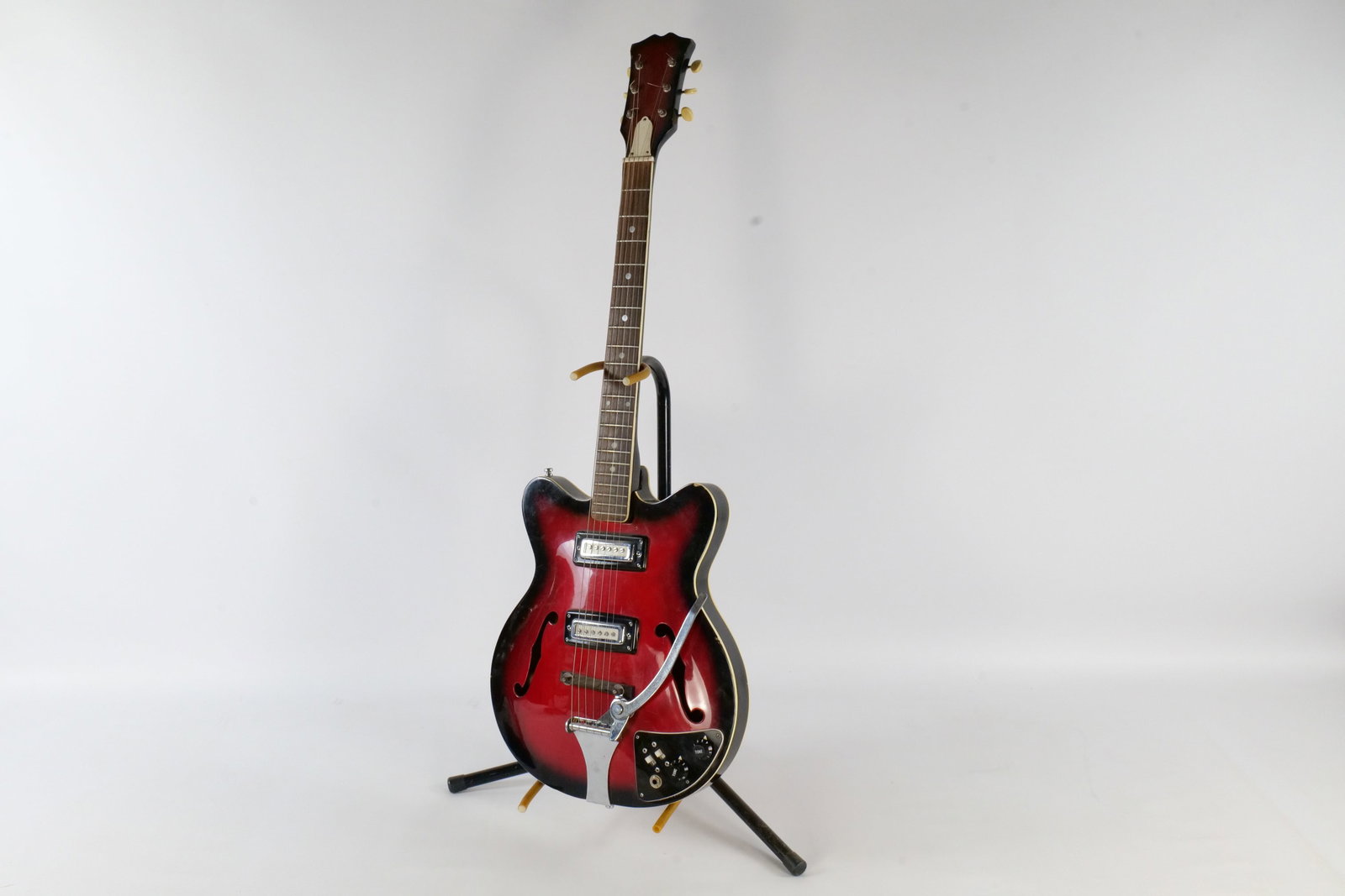 Vintage 1960's Hollow Body Red Sunburst Electric Guitar: Vintage 1960's Hollow Body Red Sunburst Electric Guitar. Made in Japan - Teisco/Kawai Era. Body is a double cutaway hollow body with dual f-holes. Contains two vintage chrome single coil pick-ups. Inc