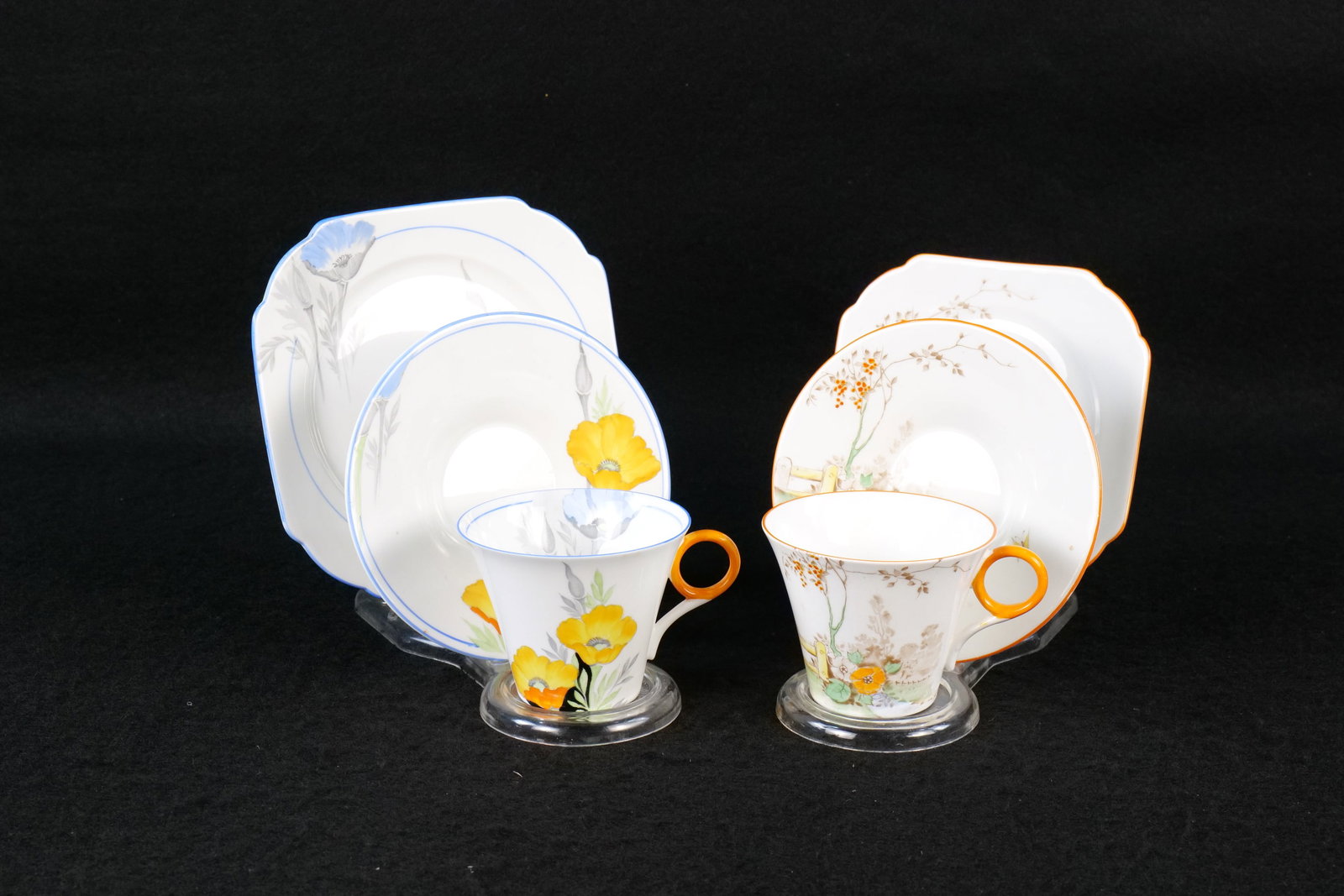 Lot of 2 Shelley Bone China Tea Trios: Lot of 2 Shelley Bone China Tea Trios. Including Regent Shaped Stile and Rose with Fence - Circa 1940-65 and Poppies Regent Shaped #12229 - Circa 1930's. This Shelley Collection came from the Judy and