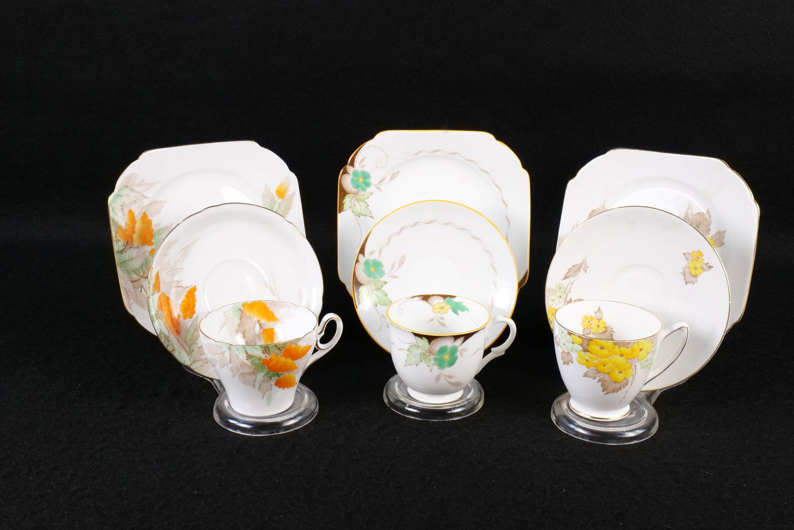 Lot of 3 Vintage Shelley Bone China Floral Tea Trios: Lot of 3 Vintage Shelley Bone China Floral Tea Trios. Including York "Yellow Phlox" #172, Brown, Empire Green and Yellow Flowers #11944, and Cambridge Orange Wisteria #0151. Circa 1930's-60's. This Sh