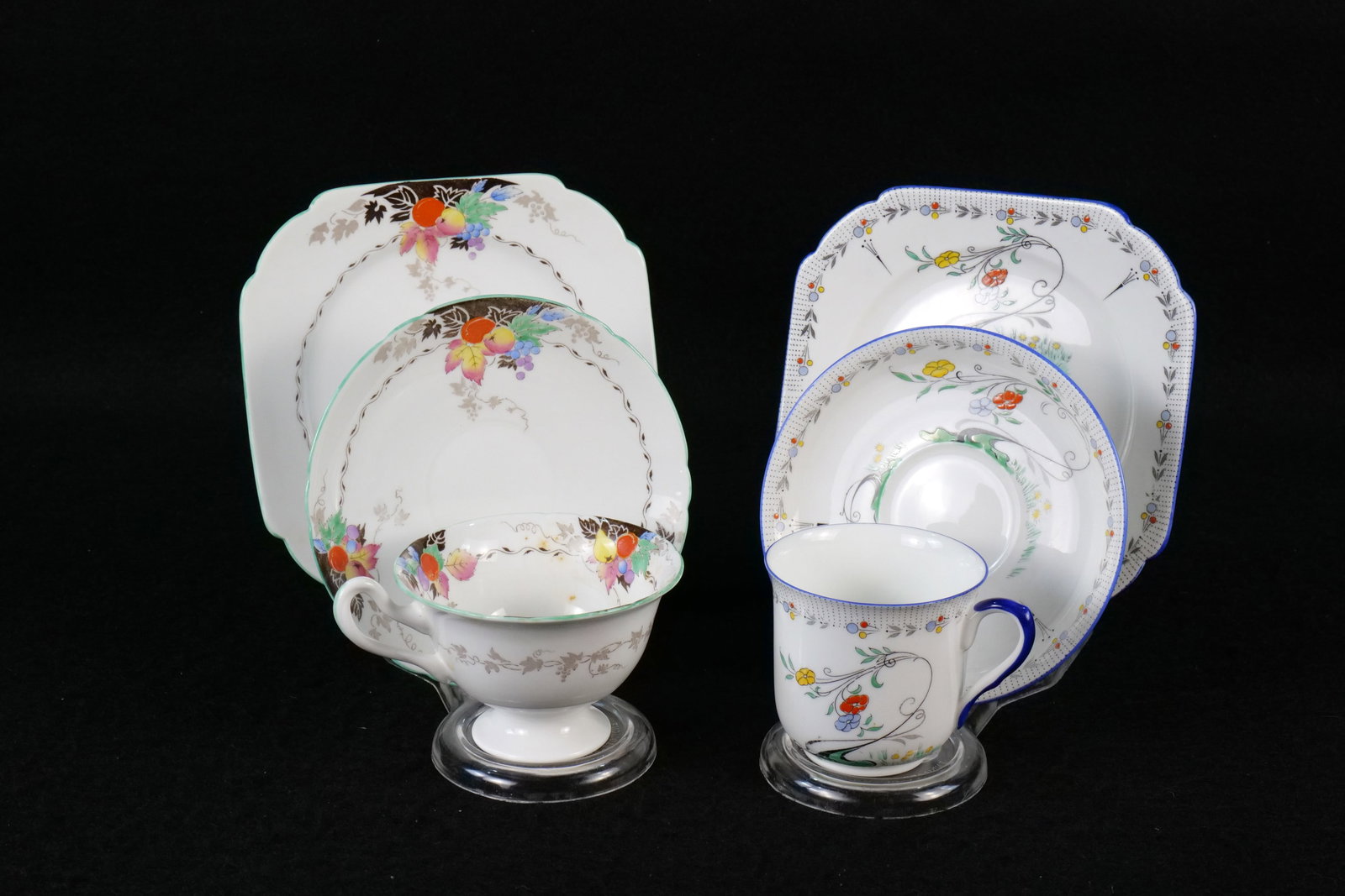 Lot of 2 Vintage Shelley Teacup Trio Sets: Lot of 2 Vintage Shelley Teacup Trio Sets. Including Gainsborough Fruit and Silver Vine #11700 and Vincent Deco Stylized Tree #11603. Both Circa 1930's. This Shelley Collection came from the Judy and 