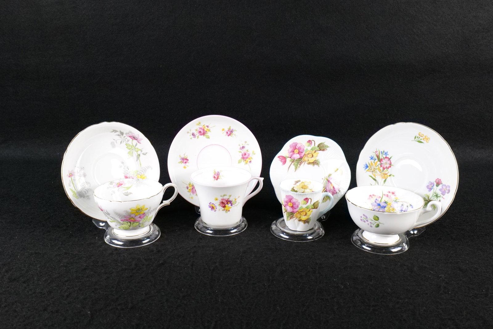 Lot of 4 Shelley Teacups and Saucer Duos: Lot of 4 Shelley Teacups and Saucer Duos. Including Begonia #13427 Demitasse - Hairline Crack in Cup, Floral Spray #13233, Anemone #0255, and Wildflowers #13668. Various Shaped Cups including Dainty, 