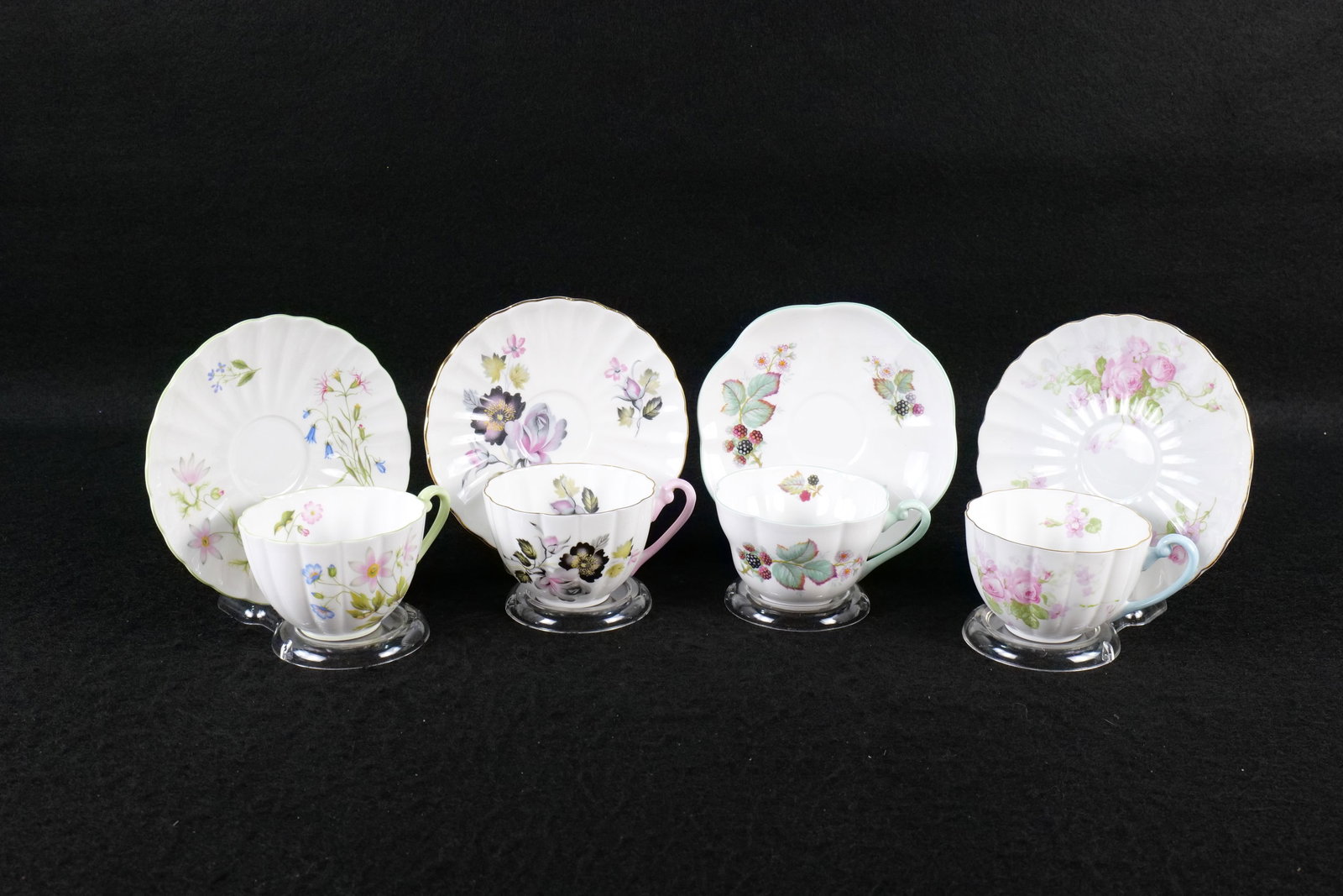 Lot of 4 Shelley Teacup and Saucer Duos: Lot of 4 Shelley Teacup and Saucer Duos. Including Ludlow Goors Rose Spray #2313, Ludlow Wind Spray #14032, Warwick Blackberry #0618, and Ludlow Wild Anemone #13977. This Shelley Collection came from 