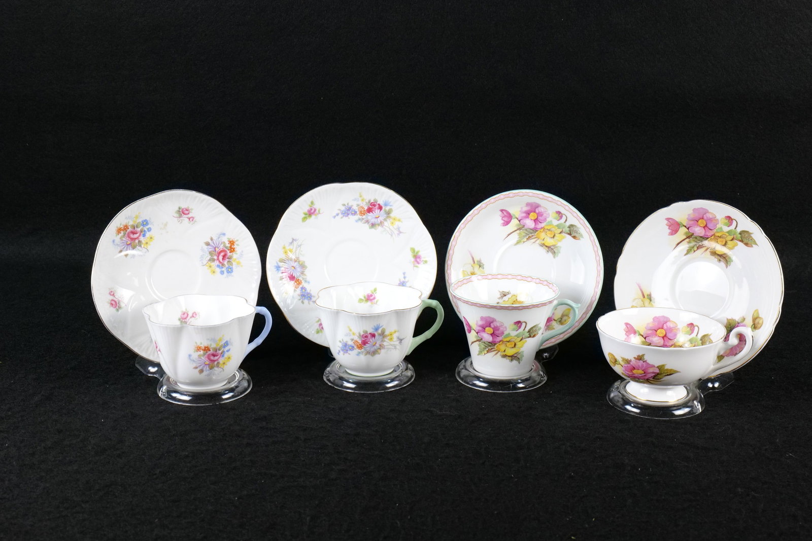 Lot of 4 Shelley Floral Bone China Teacups and Saucers: Lot of 4 Shelley Floral Bone China Teacups and Saucers. Including 2 Begonia - #13511 Perth Shaped - Some transfer loss at the rim and other without a pattern # - Lincoln Shaped, Dainty Georgian and Ro