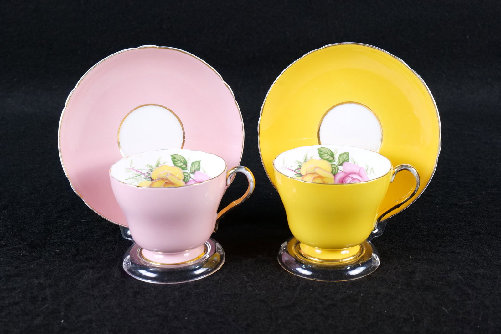 Lot of 2 Shelley Pink and Yellow Roses Teacups and Saucer Sets: Lot of 2 Shelley Pink and Yellow Roses Teacups and Saucer Sets. Including One in Yellow and Other in Pink. Both not numbered. Some wear to gold gilt. This Shelley Collection came from the Judy and Jer