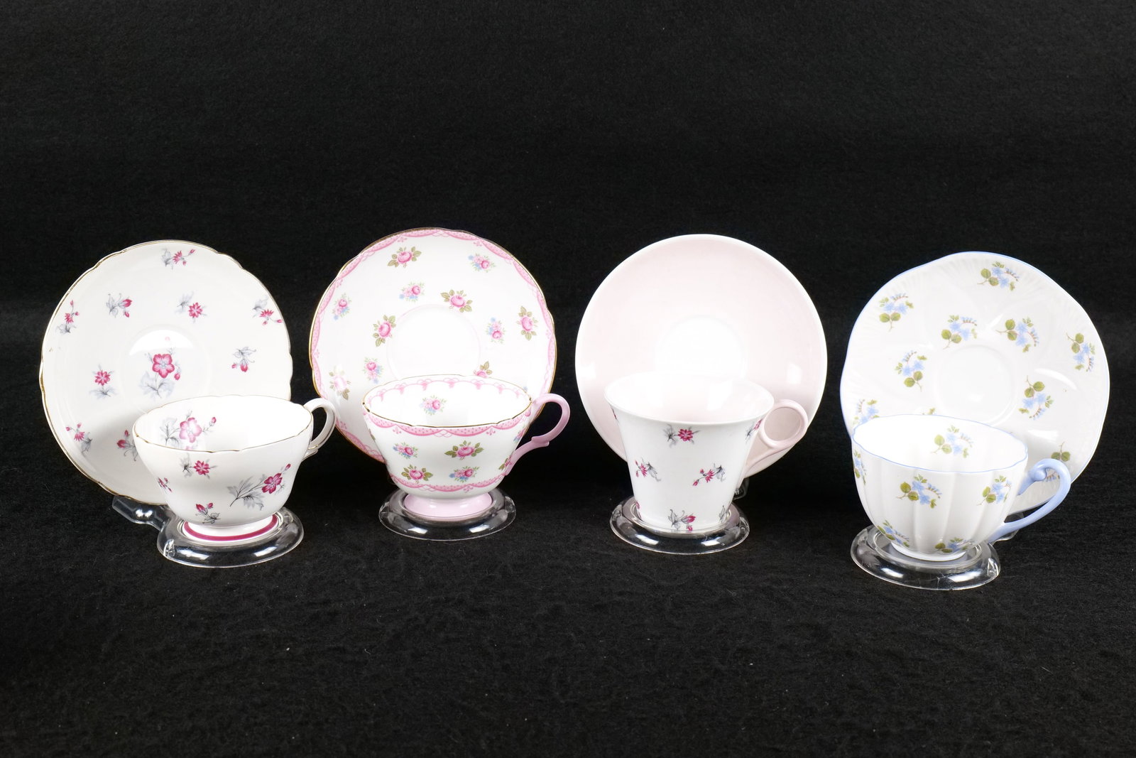 Lot of 4 Shelley Floral Teacups and Saucers: Lot of 4 Shelley Floral Teacups and Saucers. Including "Charm" Henley #13752 Maroon, "Charm" Regent #13767 - Pink and Maroon, Ludlow "Forget-Me-Nots" #13768, and Henley Rose #13520. This Shelley Colle