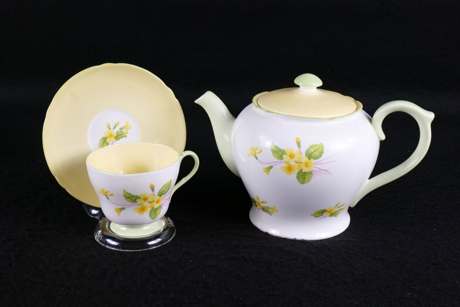 Shelley "Primrose" Pattern Teapot, Teacup and Saucer: Shelley "Primrose" Pattern Teapot, Teacup and Saucer. Both marked #13745 - Richmond Shaped. Teapot measures 6" tall x 9.25" wide. This Shelley Collection came from the Judy and Jerry Silverman Collect