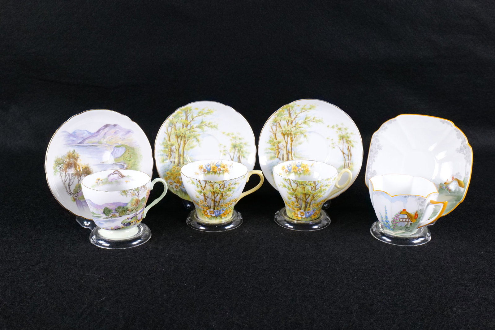 Lot of 4 Shelley "Scenic" Teacups and Saucers: Lot of 4 Shelley "Scenic" Teacups and Saucers. Including 2 x Daffodil #13370 in Cambridge and New Cambridge, Queen Anne Cottage-2 #11621, and Richmond "English Lakes" #13788. This Shelley Collection c