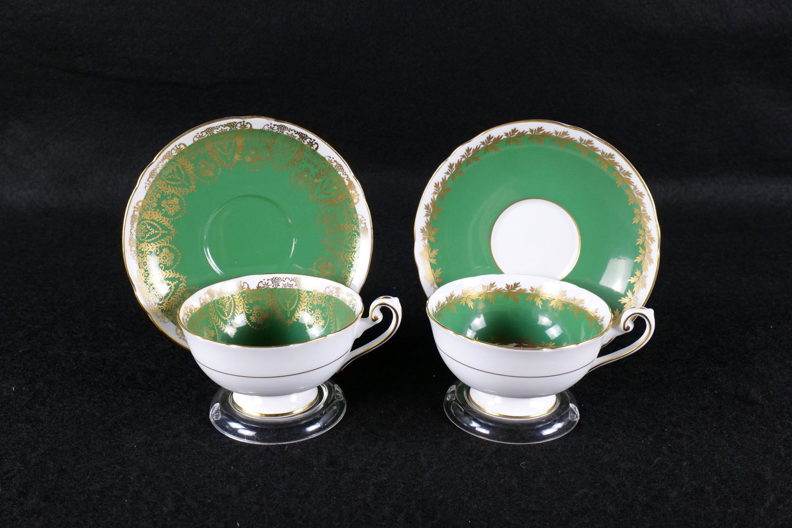 Lot of 2 Shelley Teacups and Saucers: Lot of 2 Shelley Teacups and Saucers. Both in Green and Gold. Pattern #0663 and #0664. Book says Boston and Lincoln. Appear to both be Lincoln though. This Shelley Collection came from the Judy and Je