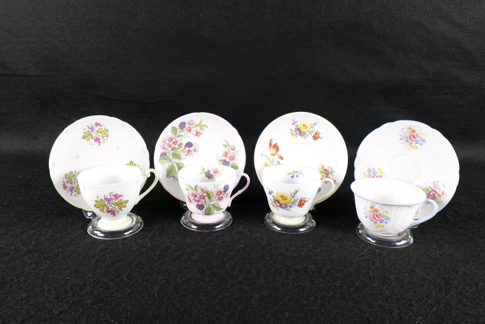 Lot of 4 Shelley Bone China Teacups and Saucers: Lot of 4 Shelley Bone China Teacups and Saucers. Including Oleander "Georgian and Bluebell" #0445 - Small chip on rim and hairline crack, Richmond Flowers and Berries - Unidentified Pattern, Ripon "Wi