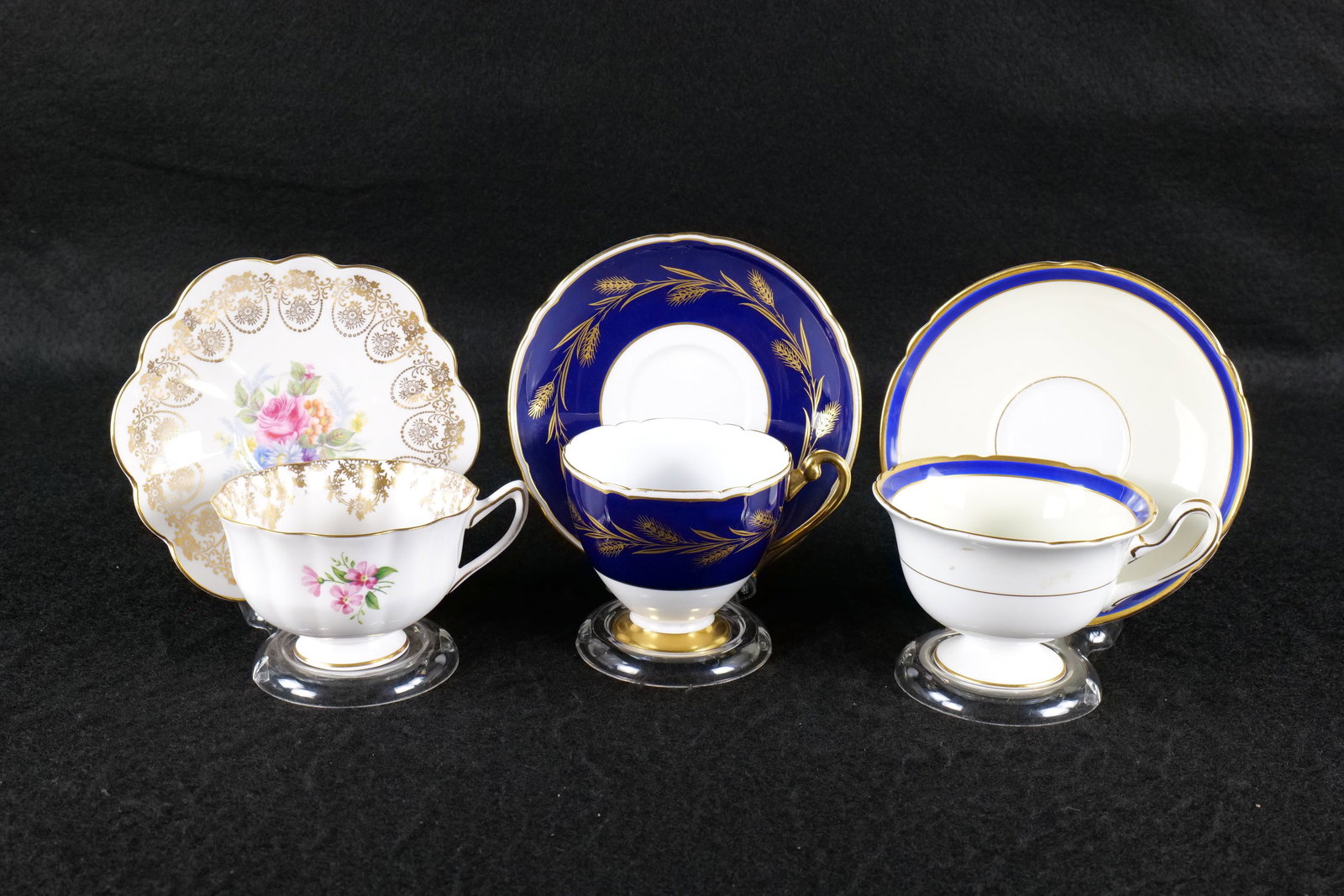 Lot of 3 Shelley Bone China Teacups and Saucers: Lot of 3 Shelley Bone China Teacups and Saucers. Including Atholl "Summer Bouquet" #0563, Ripon "Golden Harvest" #13789, and Gainsborough Cobalt and Gold #12750. This Shelley Collection came from the 