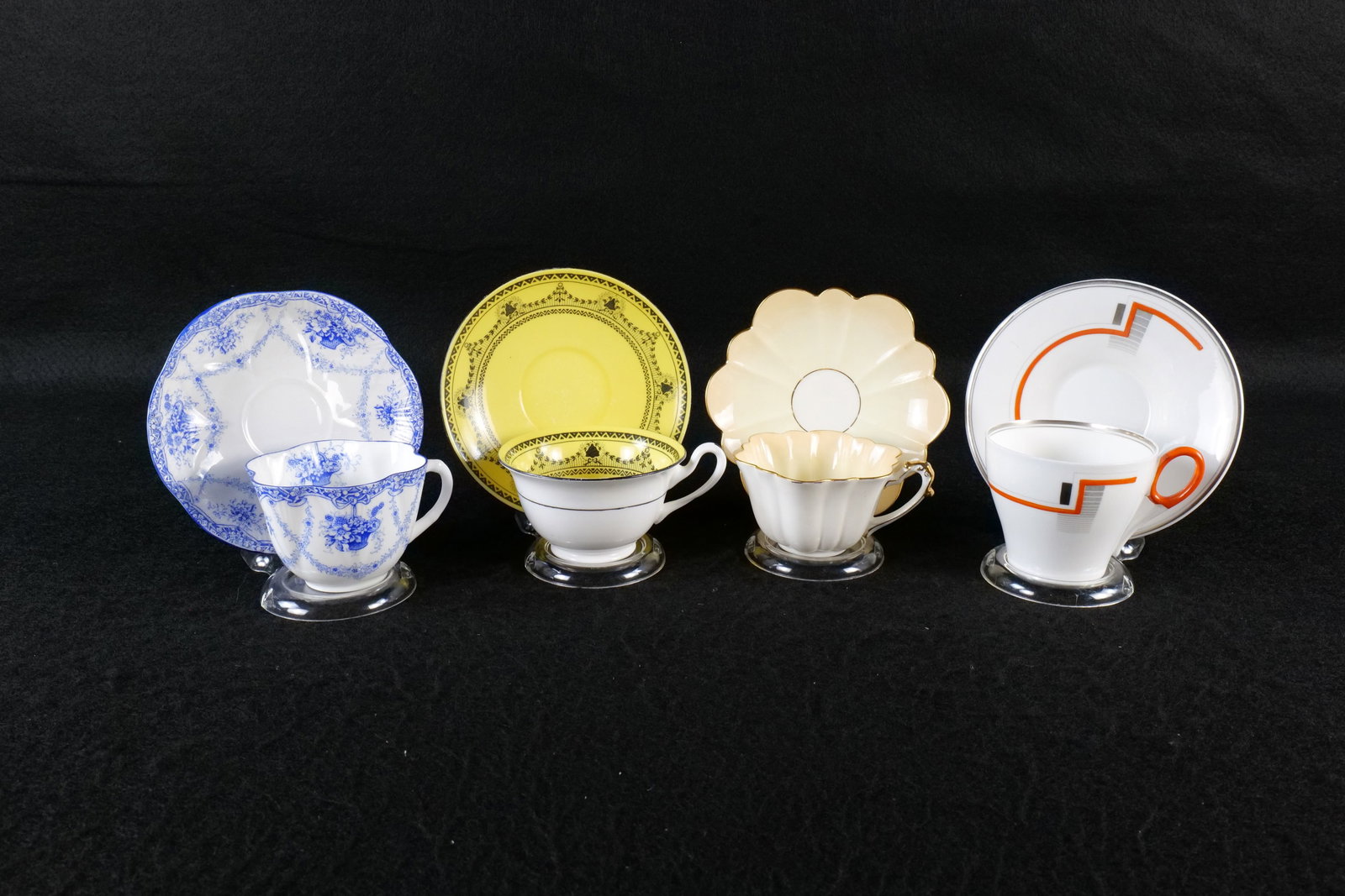Lot of 4 Shelley Bone China Teacups and Saucers: Lot of 4 Shelley Bone China Teacups and Saucers. Including Oxford Bands and Blocks #12316, Milton "Worcester" #2064, Foley Marked Empire Shaped Yellow and Ivory #6509, and Dainty "Basket Festoon" #136