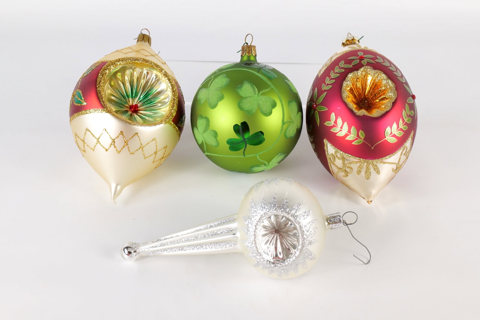 Lot of 4 Blown Glass Ornaments: Lot of 4 Blown Glass Ornaments. Including 3 Waterford Holiday Traditions and One Unmarked. Ball, Reflector, and Drop Style. Largest measures 7" long. All invoices must be paid within 24 hours of the s