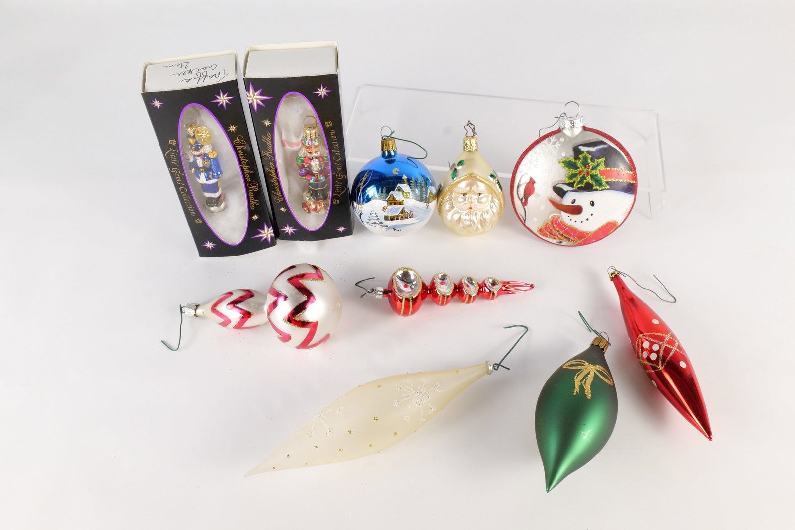 Lot of Blown Glass Christmas Ornaments: Lot of Blown Glass Christmas Ornaments. Including 2 x Christopher Radko Little Gems Nutcrackers with Boxes, Unsigned Red Glass Reflector Finial, Unsigned Red and White Drop, Marked Germany Green Drop 