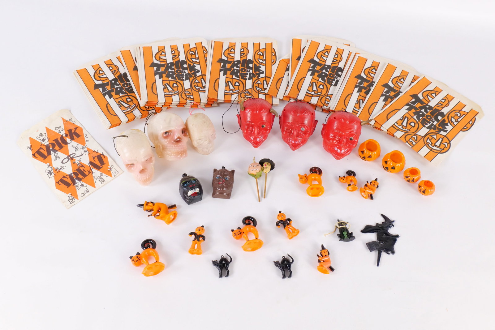 Lot of Vintage Halloween Items: Lot of Vintage Halloween Items. Including Trick-Or-Treat Paper Bags, Plastic Lenticular Eyes Hanging Ornaments - Skulls and Devils - Devils are missing horns, Plastic Cake Toppers, Monster Charms, Too