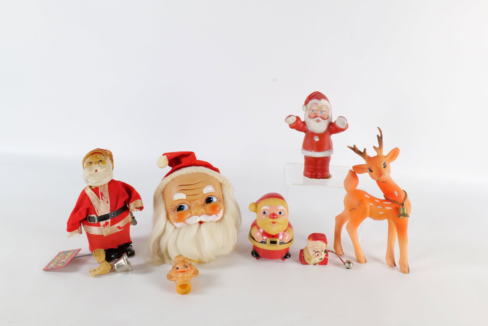 Lot of Vintage Christmas Items: Lot of Vintage Christmas Items. Including Musical Santa Head with Pull Down Elf Head - Missing Body, AS-IS Mechanical Santa, Wind Up Rubber Santa, Santa Pin - Not working, Rubber Deer - Out of Shape, 