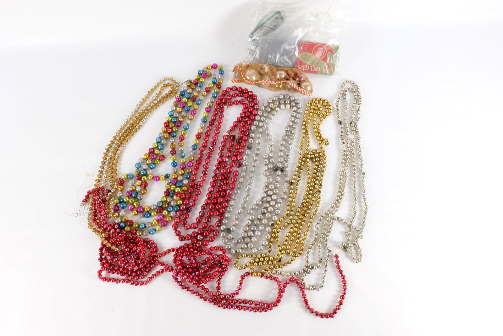 Lot of Glass Beaded Garland, Glass Ornaments, Caps and Hooks: Lot of Glass Beaded Garland, Glass Ornaments, Caps and Hooks. Garland has some broken pieces. Balls are missing some caps. All invoices must be paid within 24 hours of the sale. We offer multiple ship