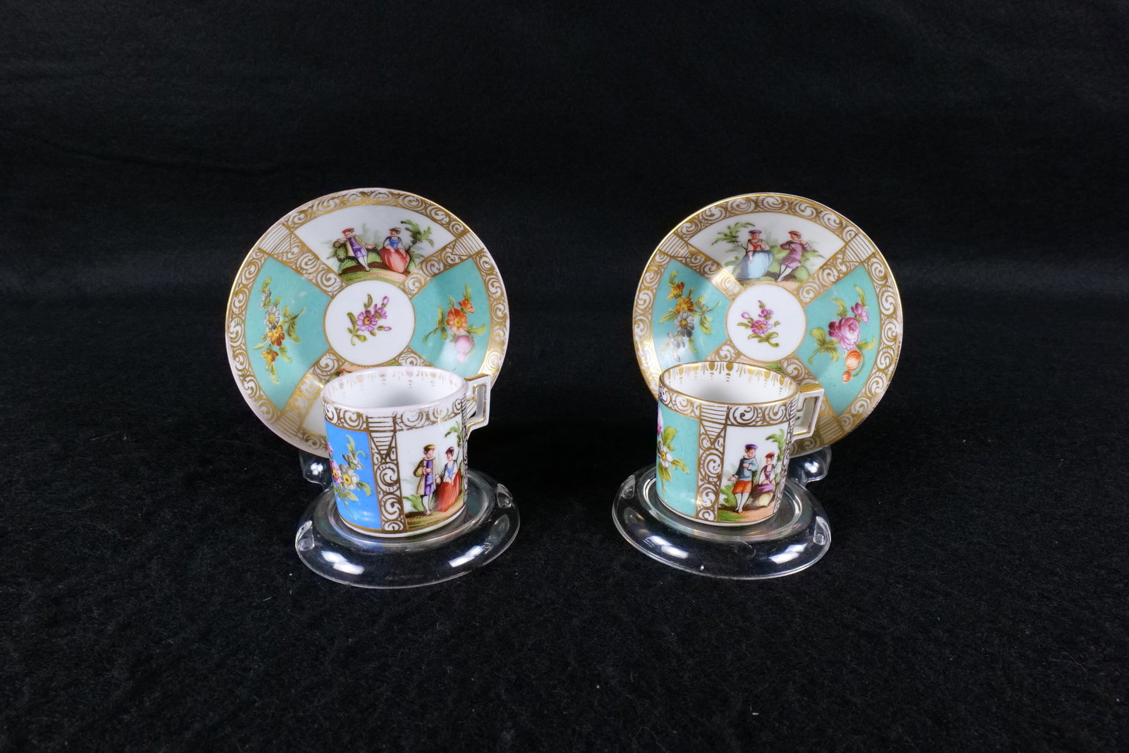 Pair of Dresden Porcelain "Quatrefoil" Cabinet Cups: Pair of Dresden Porcelain "Quatrefoil" Cabinet Cups. Studio of Franziska Hirschi. Colors are mismatched but that is how it came. Some light fading. Marked on bottom. Cup measures 1.75" tall. Saucer is