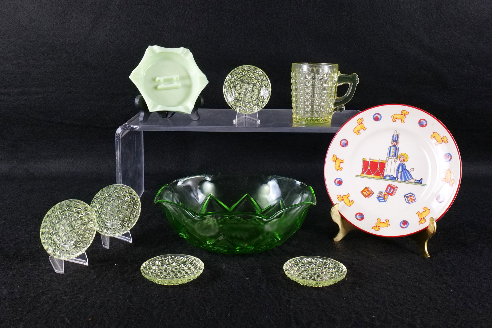 Lot of Porcelain and Glass Pieces: Lot of Porcelain and Glass Pieces. Including Green Depression Bowl, Tiffany & Co. Child Plate by Mason's, Jadeite Green Ashtray, and Yellow Depression Pieces - Some chips to edges. All invoices must b