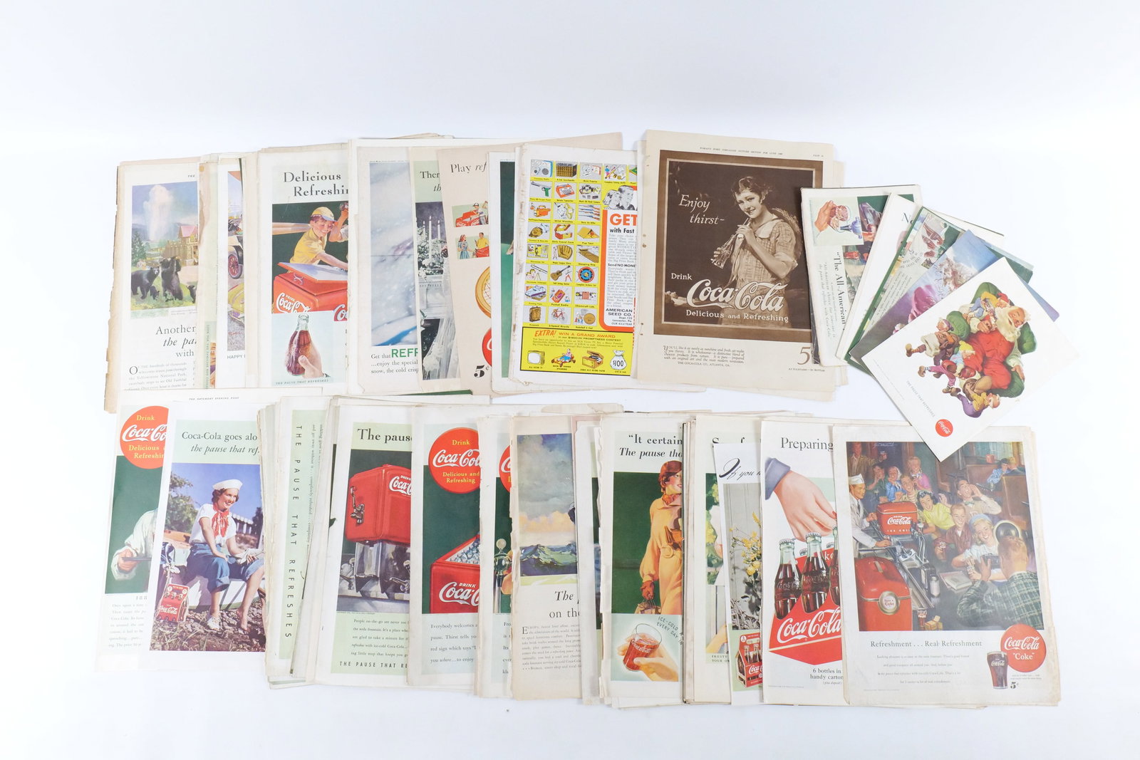 Lot of Coca Cola Advertising: Lot of Coca Cola Advertising. Some tearing and discoloration. All invoices must be paid within 24 hours of the sale. We offer multiple shipping options, please read the terms to understand your option