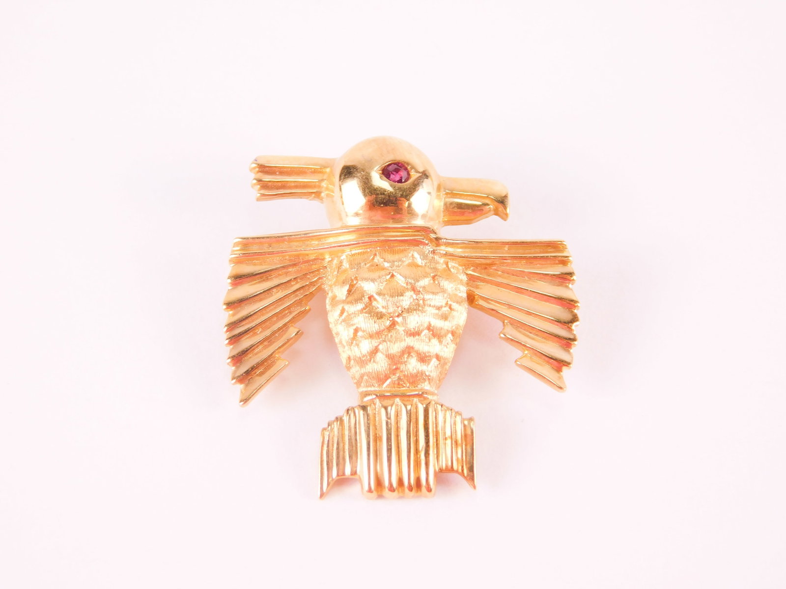 14k Yellow Gold Mexican Aztec Bird Brooch/Pin: 14k Yellow Gold Mexican Aztec Bird Brooch/Pin with Gemstone Eyes. Marked. Measures 1 1/8". Weighs approx. 7.6 grams with gemstone. All invoices must be paid within 24 hours of the sale. We offer multi