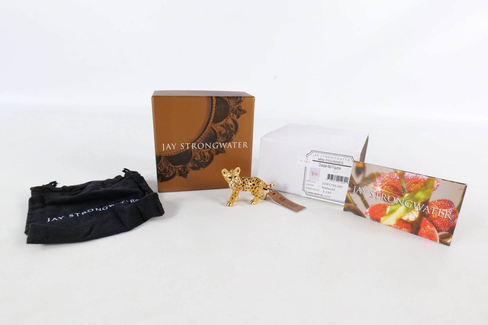 Jay Strongwater Cheetah Mini Figurine: Jay Strongwater Cheetah mini figurine. From the Mini Figurines collection. Color Natural. Style # SDH1791280. Tiny little cheetah cub in light brown and cream enamel has amber enamel and amber rhinest