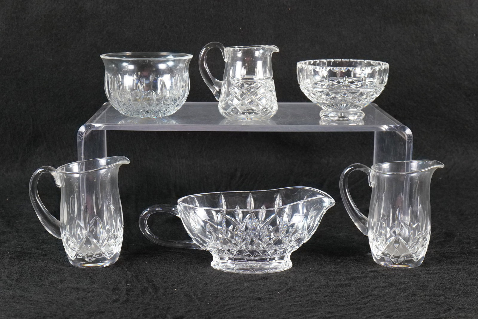 Group of Waterford Crystal: Group of Waterford crystal including creamers, sugars and gravy boat. Various patterns. Largest measures approx. 5" tall. All invoices must be paid within 24 hours of the sale. We offer multiple