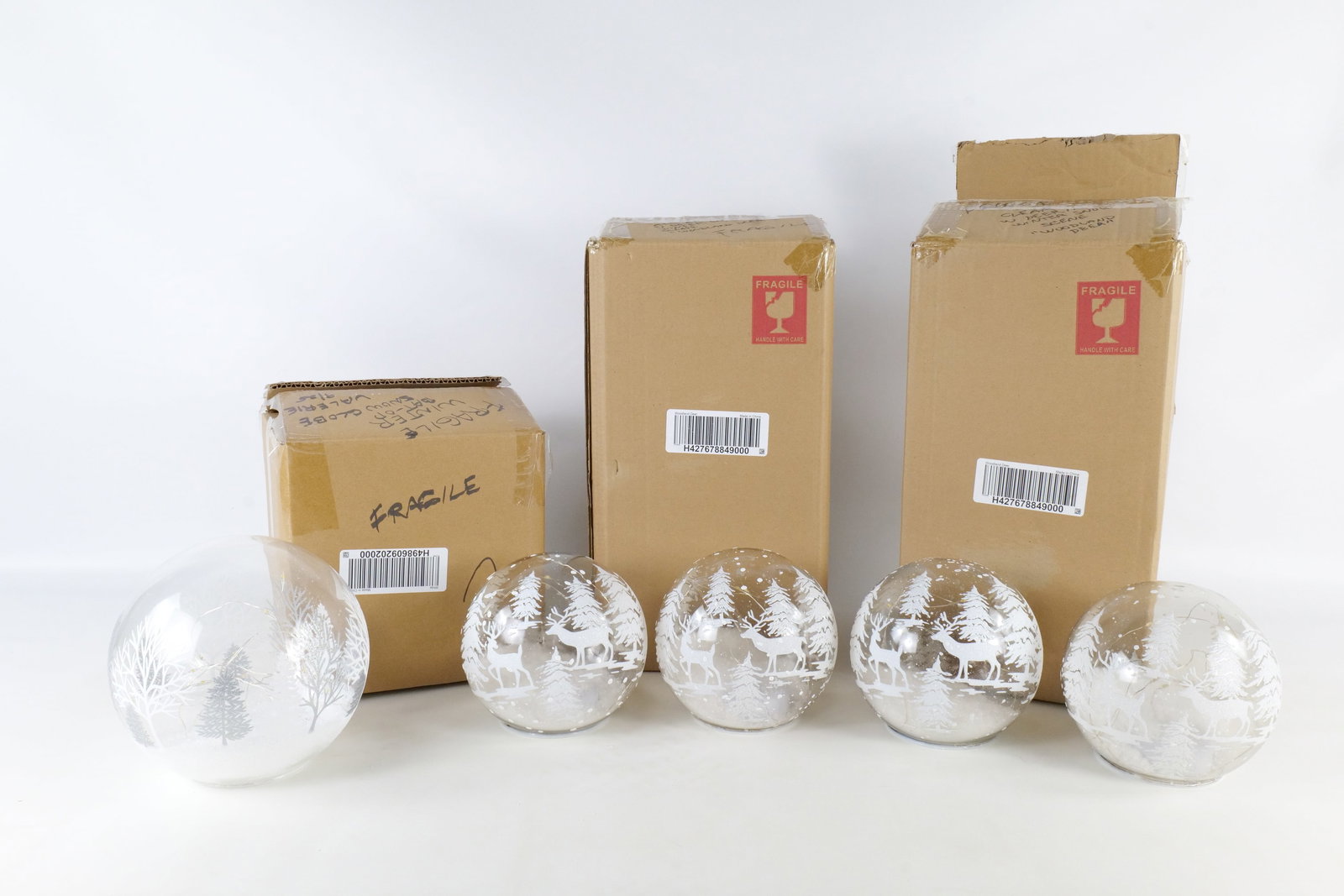 Group of Winter D?cor: Lot of 5 Valerie lighted snow globes with winter scenes. All come with boxes. Largest measures 7" in diameter. All invoices must be paid within 24 hours of the sale. We offer multiple shipping options