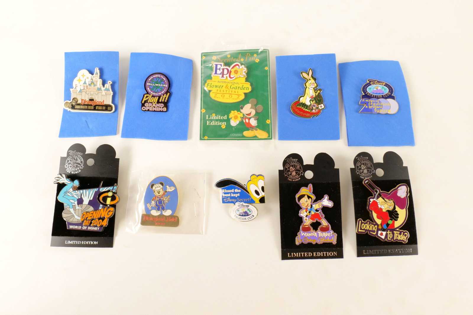 Lot of 10 Vintage and Limited Edition Disney Pins: Lot of 10 Vintage and Limited Edition Disney Pins. Including 2002 Epcot Flower and Garden Festival Scented Limited Edition Pin, Pinocchio Wanna Trade Limited Edition Pin on Card, Captain Hook Looking 