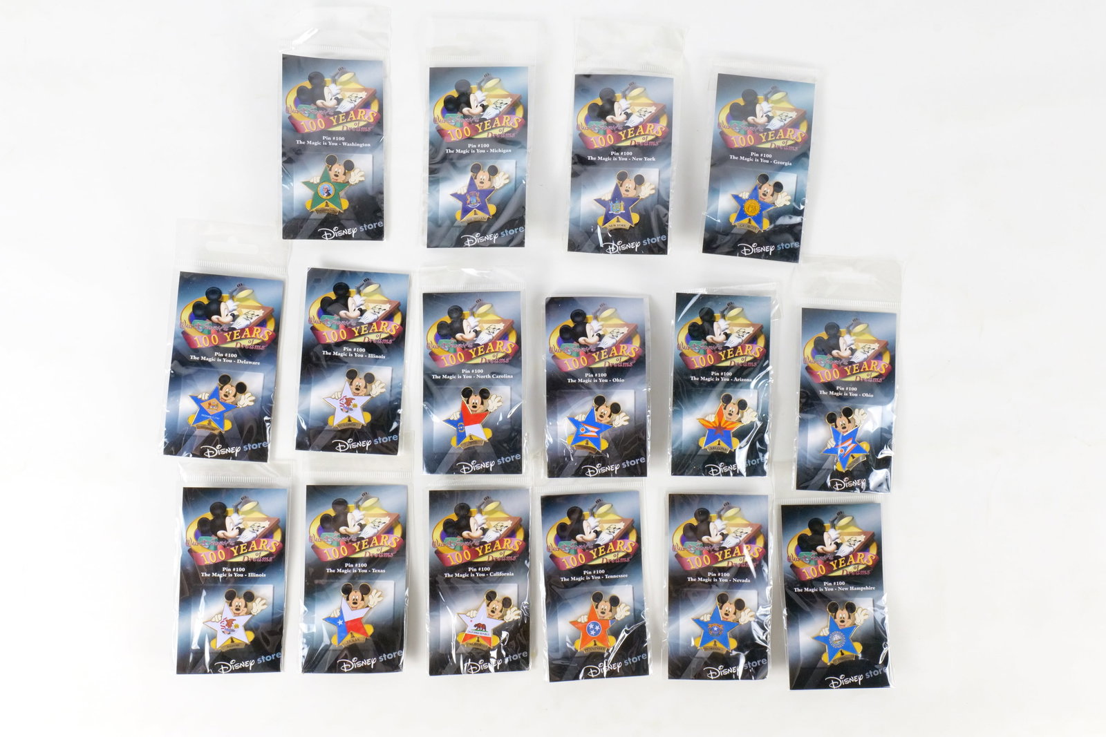 Lot of 16 Disney Store 100 Years of Dreams Pins: Lot of 16 Disney Store 100 Years of Dreams Pins. All Pin #100 - The Magic is You. Including 2 x Texas, 2 x Illinois, Tennessee, 2 x New Hampshire, 2 x Ohio, Delaware, Arizona, California, Washington, 