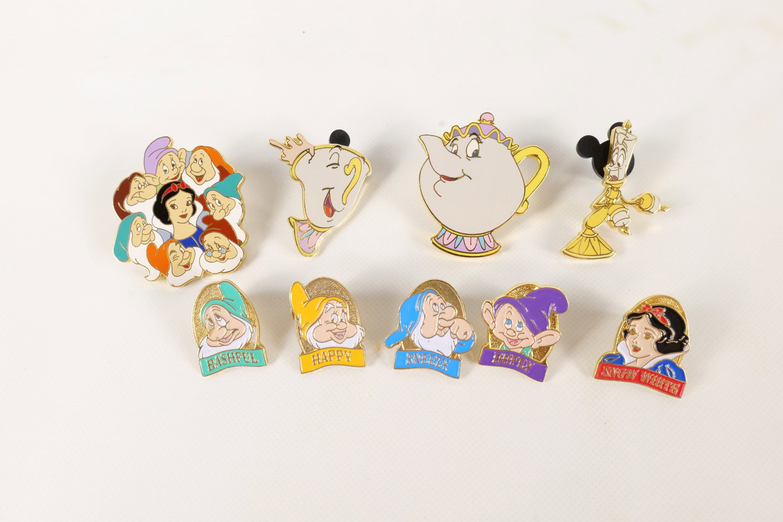 Lot of 9 Disney Character Pins: Lot of 9 Disney Character Pins. Including Snow White Character, Snow White Title, 4 Dwarfs, Mrs. Potts and Chip, and Lumiere. All invoices must be paid within 24 hours of the sale. We offer multiple s