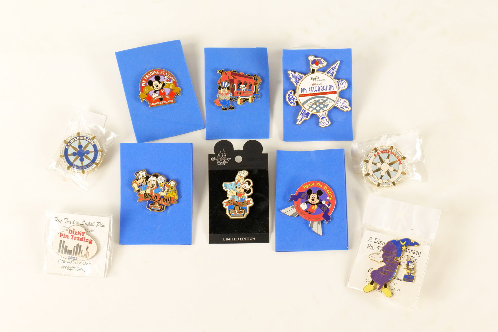 Lot of 10 Disney Pin Trading Pins: Lot of 10 Disney Pin Trading Pins. Including Build A Pin, Epcot, Dizny Pin Trading, and More. One comes with Disney card back. All invoices must be paid within 24 hours of the sale. We offer multiple 