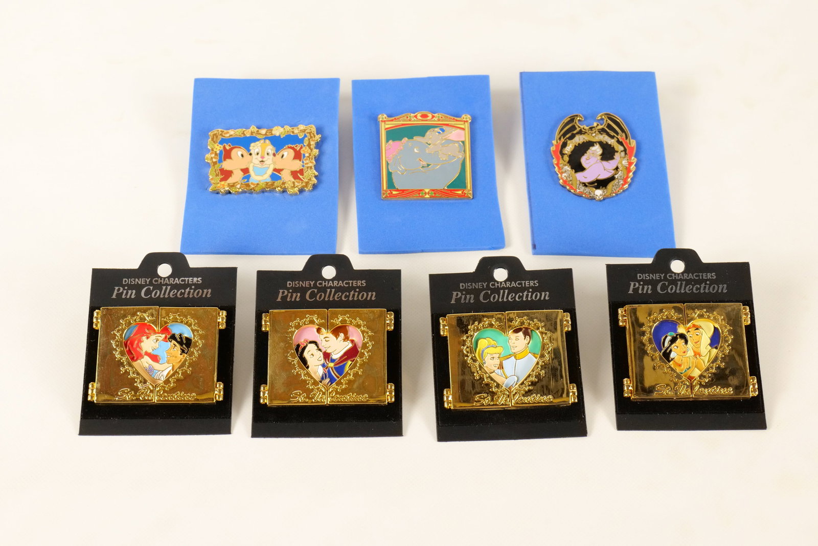 Lot of 7 Disney Pins: Lot of 7 Disney Pins. Including 4 Hinged St. Valentine Hinged Couples Limited Edition Pins, Chip and Dale, Ursula and Chernabog, and Dumbo with Mother. All invoices must be paid within 24 hours of the