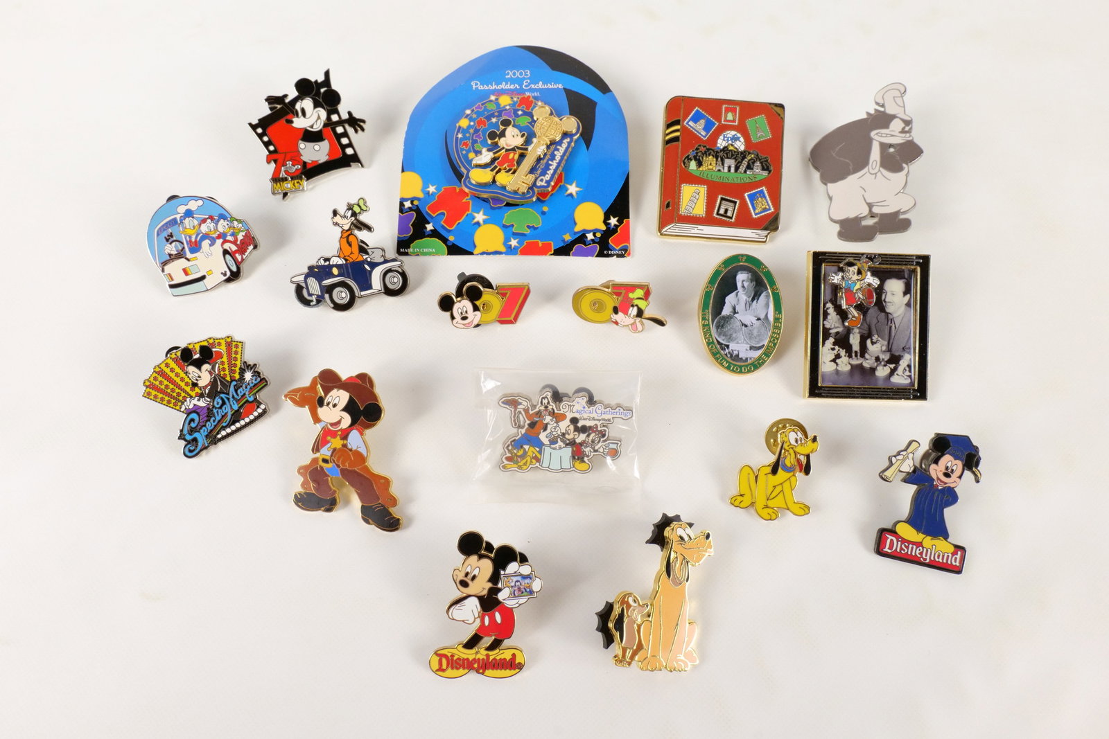 Lot of 17 Disney Character Pins: Lot of 17 Disney Character Pins. Including Mickey 2003 Passholder Exclusive, Illuminations, Disneyland Mickey, Walt with Pinocchio, 75 Years with Mickey, Pete, Goofy, and More. One comes with card bac