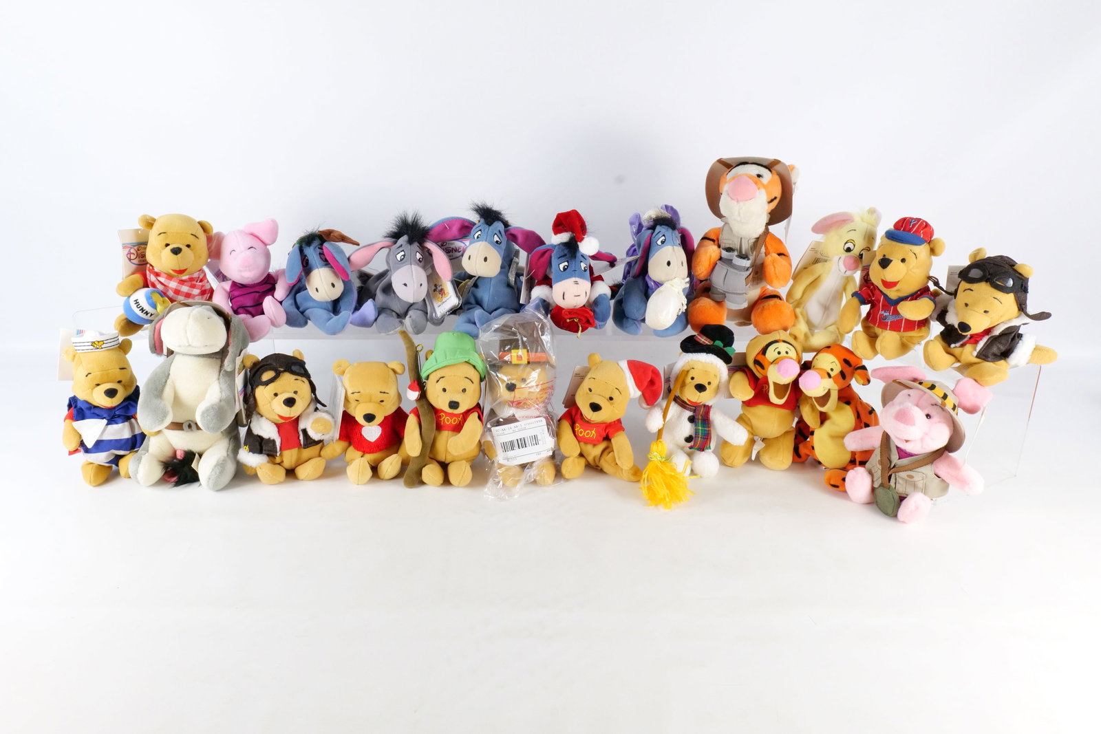 Lot of Disney Bean Bag Plush: Lot of Disney Beanbag Plush. Including. Tigger, Eeyore, Pooh Bear, Rabbit, and Piglet. Many have tags attached. All invoices must be paid within 24 hours of the sale. We offer multiple shipping option