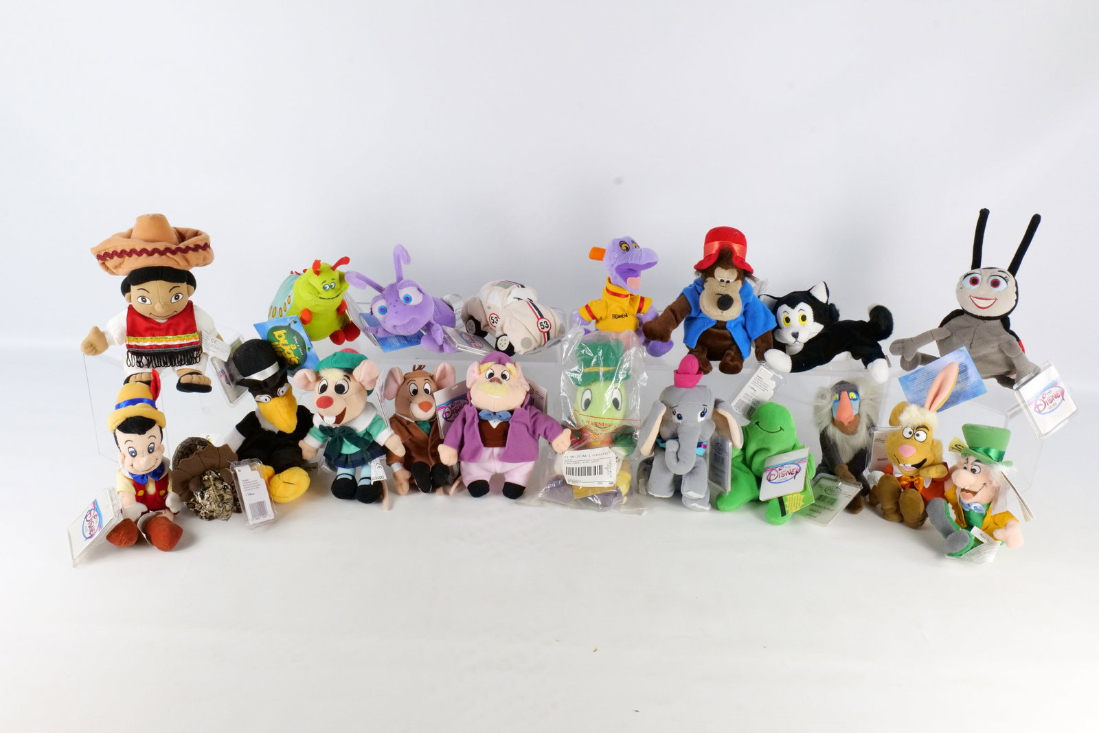 Lot of Disney Bean Bag Plush: Lot of Disney Bean Bag Plush. Including Dot from A Bug's Life, Jiminy Cricket , Mad Hatter, Gus, Jack, Pinocchio, Dumbo, Herbie, and More All invoices must be paid within 24 hours of the sale. We offe