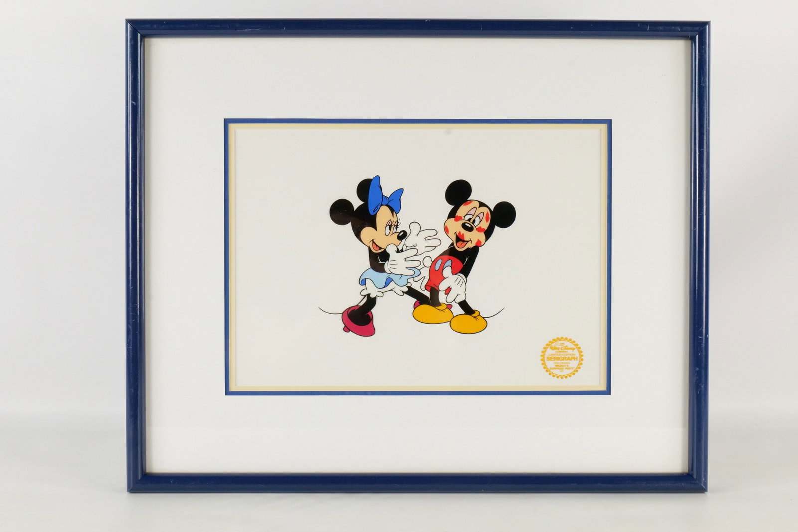 Walt Disney "Minnie Loves Mickey" Limited Edition Serigraph Cel: Walt Disney "Minnie Loves Mickey" Limited Edition Serigraph Cel. From Mickey's Surprise Party Artwork. Limited edition to 9500 pieces, Comes with COA on the back. Framed and matted. Frame has some scr