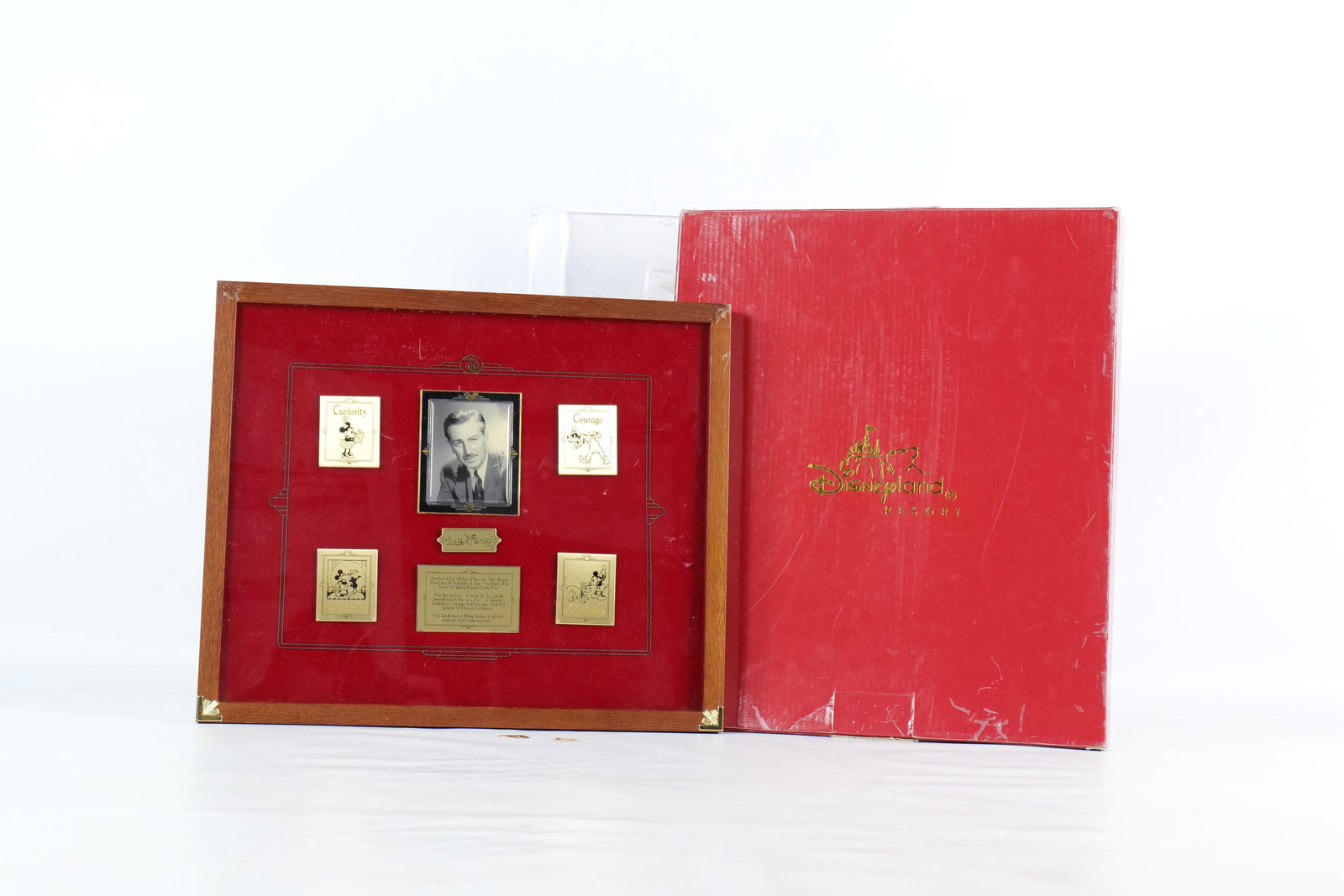 Framed Disney "Secret of Making Dreams Come True" Pin Set: Framed Disney "Secret of Making Dreams Come True" Pin Set. Featuring Walt Disney in the center and four gold tone pins representing Curiosity, Courage, Confidence, and Constancy. Also includes a metal