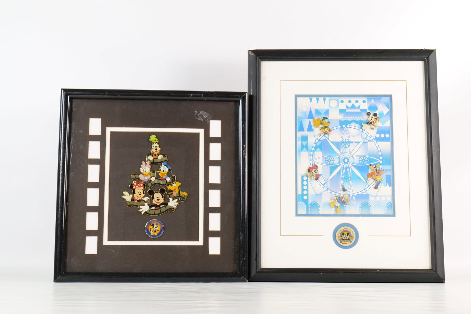 Lot of 2 Disneyana Convention Framed Pin Sets: Lot of 2 Disneyana Convention Framed Pin Sets. Including 1998 and 2000. The 1998 pin set features the sensational six with film strip reels. The 2000 pin set features the Fabulous Five on the small wo