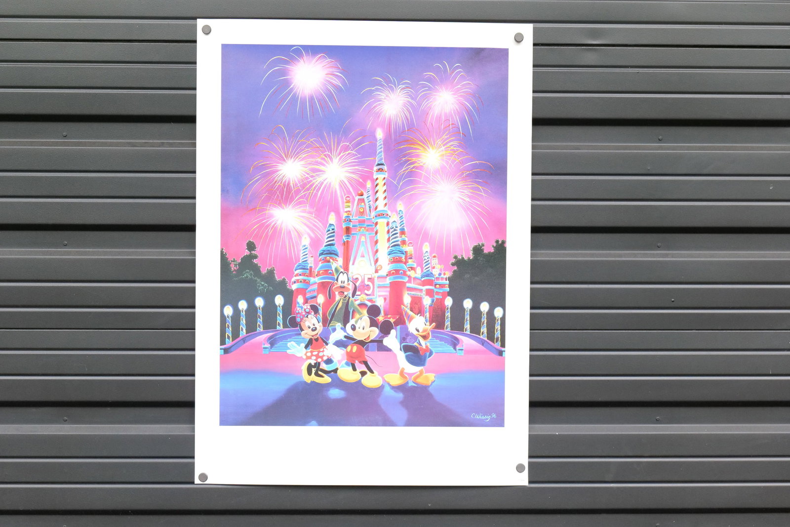 Walt Disney Limited Edition Commemorative Lithograph: Walt Disney Limited Edition Commemorative Lithograph "25 Magical Years". Features the Cinderella Castle cake with Mickey, Minnie, Goofy, and Donald. Signed by Charles Wissig. #22 out of 250. Dated 199