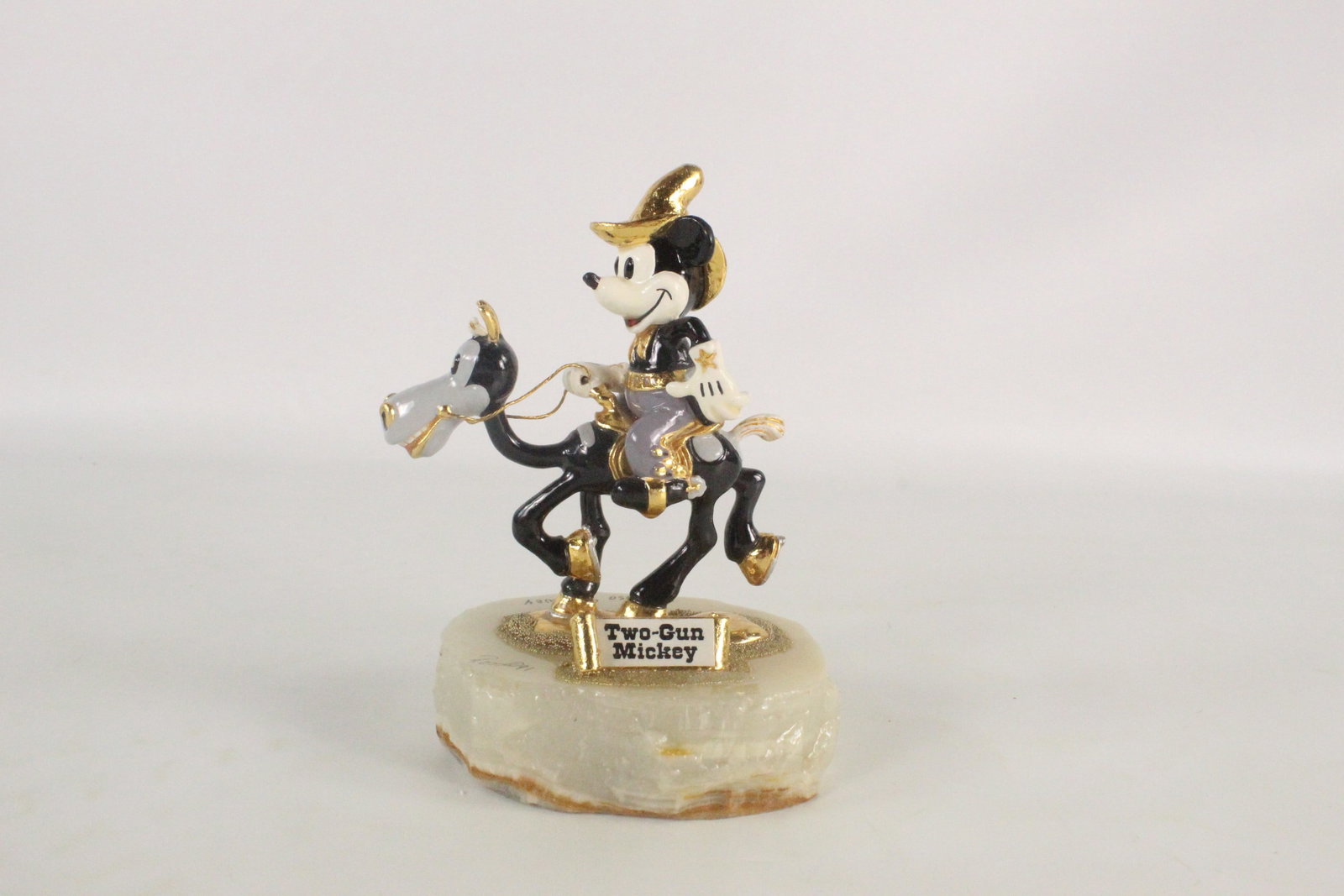 Disney Ron Lee "Two-Gun Mickey" Limited Edition Figurine: Disney Ron Lee "Two-Gun Mickey" Limited Edition Figurine. Hand painted with gold metal accents. Mounted on polished Onyx base. Hand signed and Dated 1991. Limited Edition #59 out of 2750. Some light w