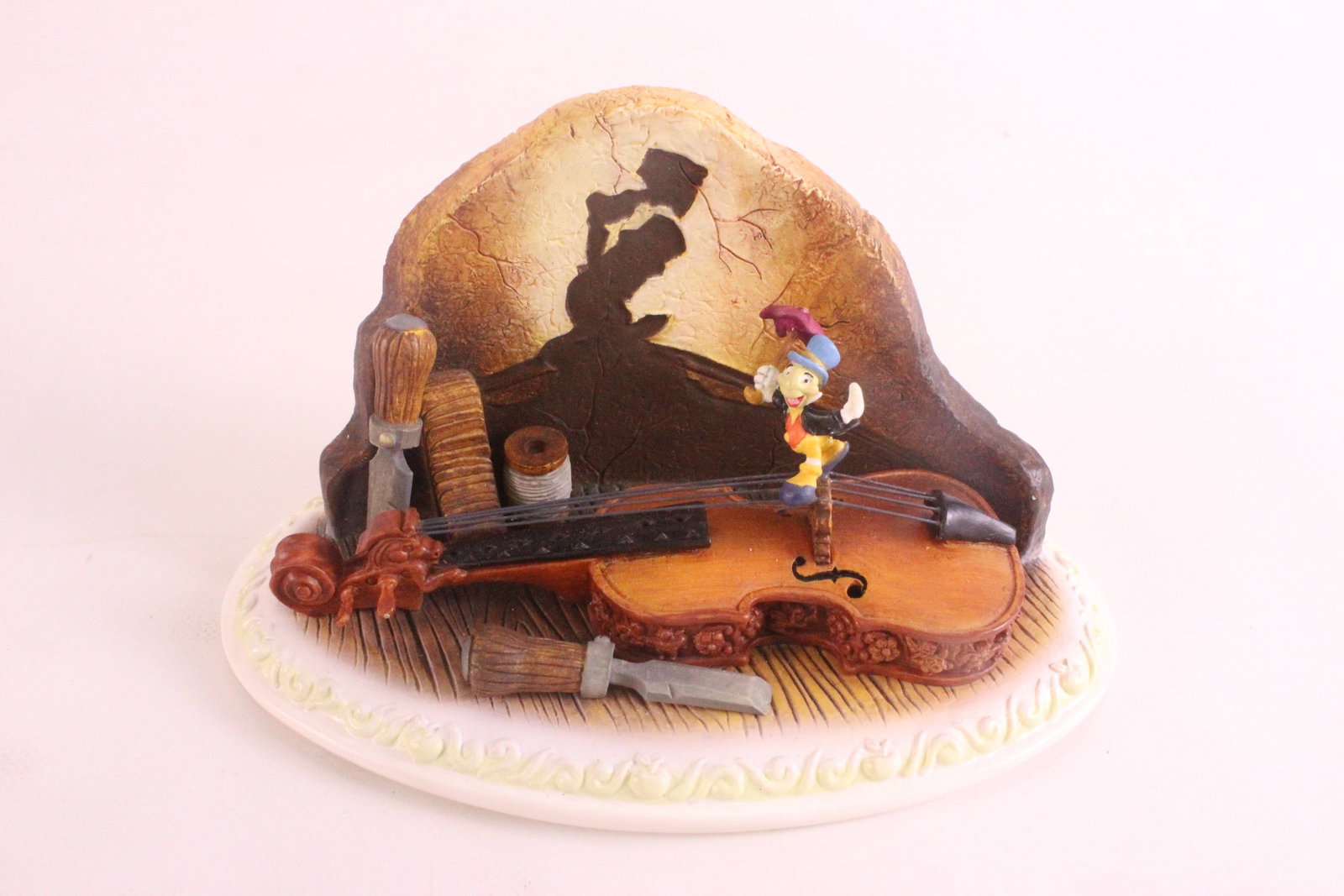 Olszewski Jiminy Cricket "Anytime You Whistle" Miniature Figurine: Disney Story Time Olszewski Jiminy Cricket "Anytime You Whistle" Miniature Figurine. Limited Edition to 3250 pieces. Jiminy is a little loose and could use a small dab of glue. Measures 2 3/4 inches t