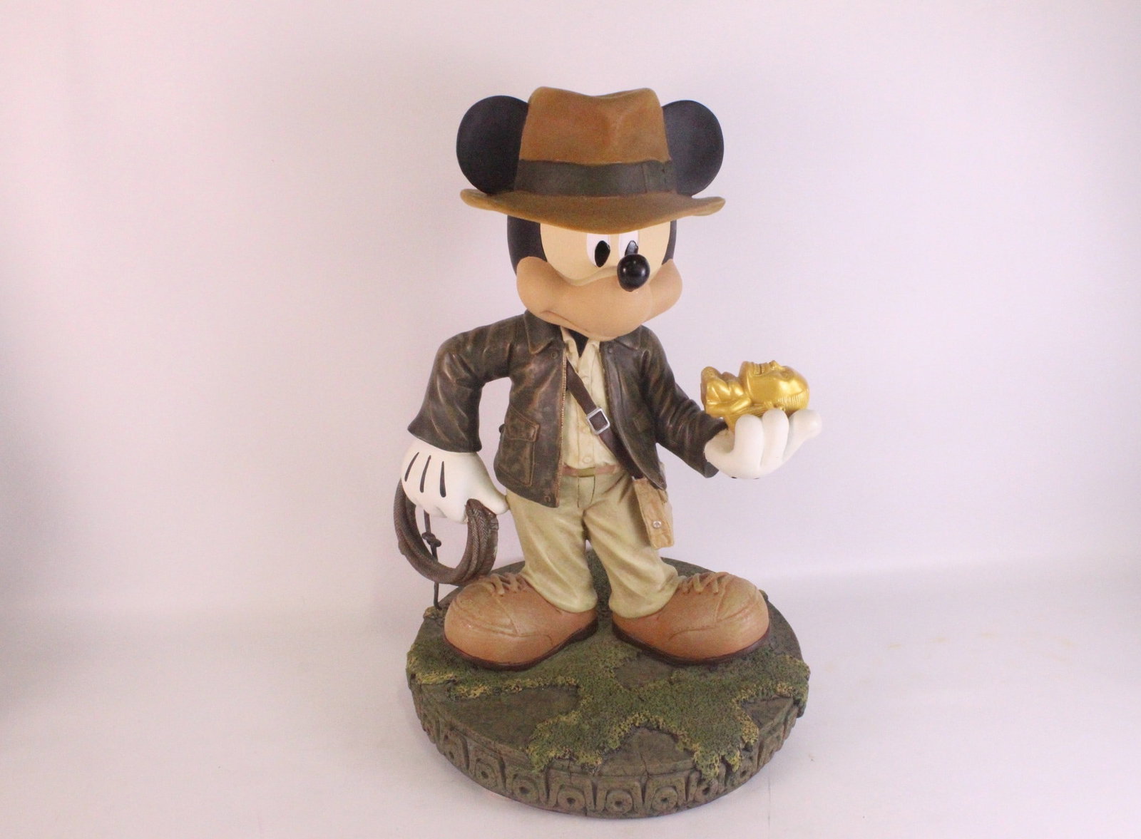 Disney Theme Parks "Mickey Mouse as Indiana Jones" Big Fig Statue: Disney Theme Parks "Mickey Mouse as Indiana Jones" Big Fig Statue. By Costa Alavezos. Dated 2009. Comes attached to base. Limited edition of 500 pieces. Comes with COA. Measures 18 inches tall. Base m