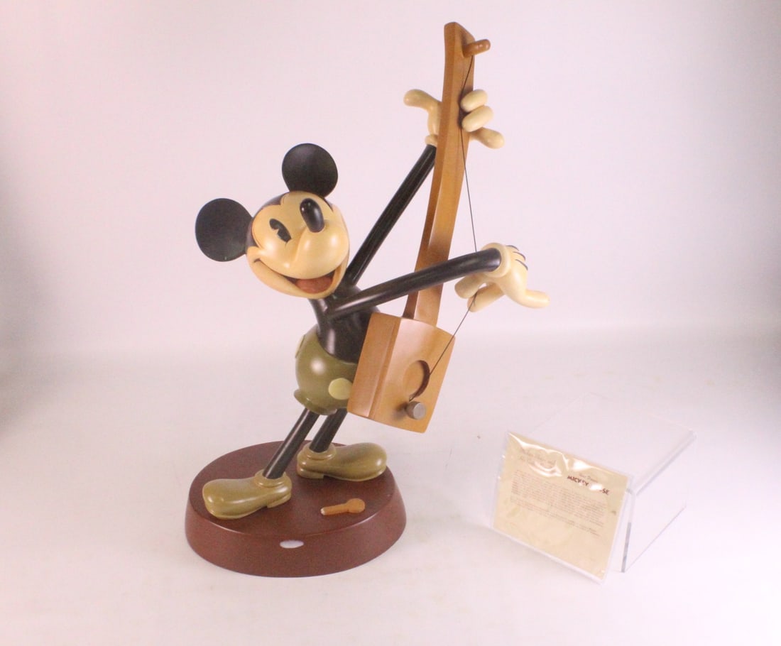 Walt Disney Collectibles Mickey Mouse and his Guitar Big Fig Statue: Walt Disney Collectibles Mickey Mouse and his Guitar Big Fig Statue. The back of the guitar knob needs to be reglued back in. Base has some scuffing. Comes with certificate. Base also has a paint mark