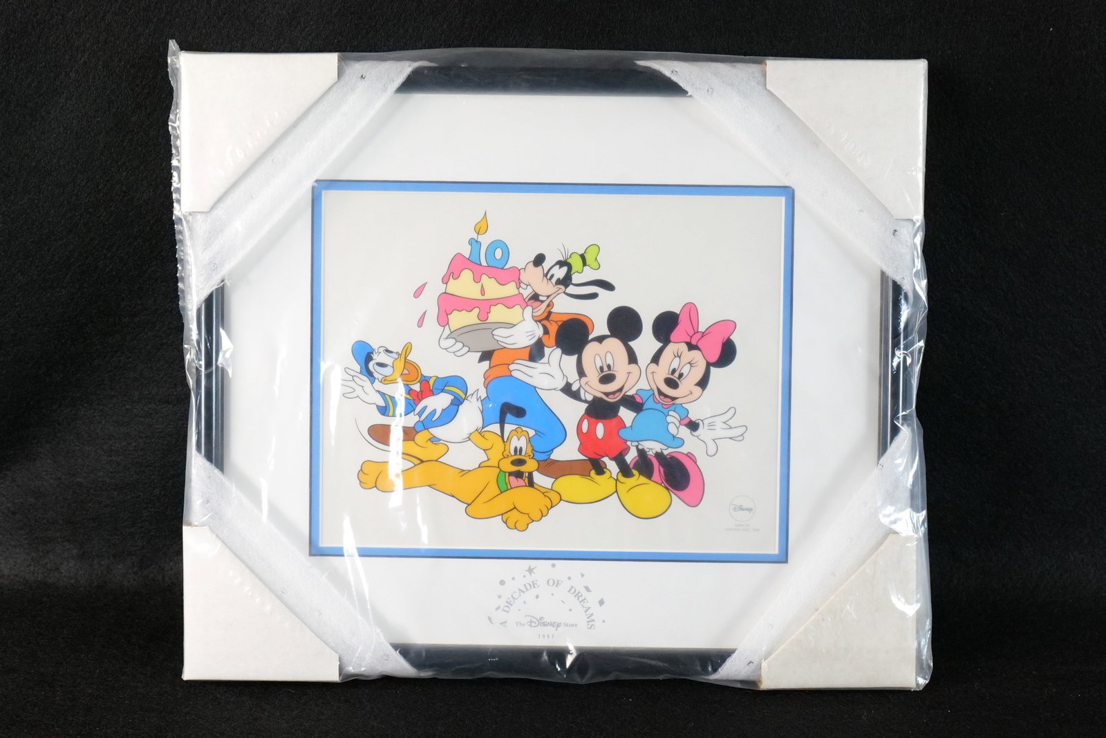 Disney Store "A Decade of Dreams" Limited Edition Sericel: Disney Store "A Decade of Dreams" Limited Edition Framed Sericel. Depicts the five classic Disney characters - Mickey, Minnie, Donald, Goofy and Pluto. Limited to 5000 pieces. New condition with COA a